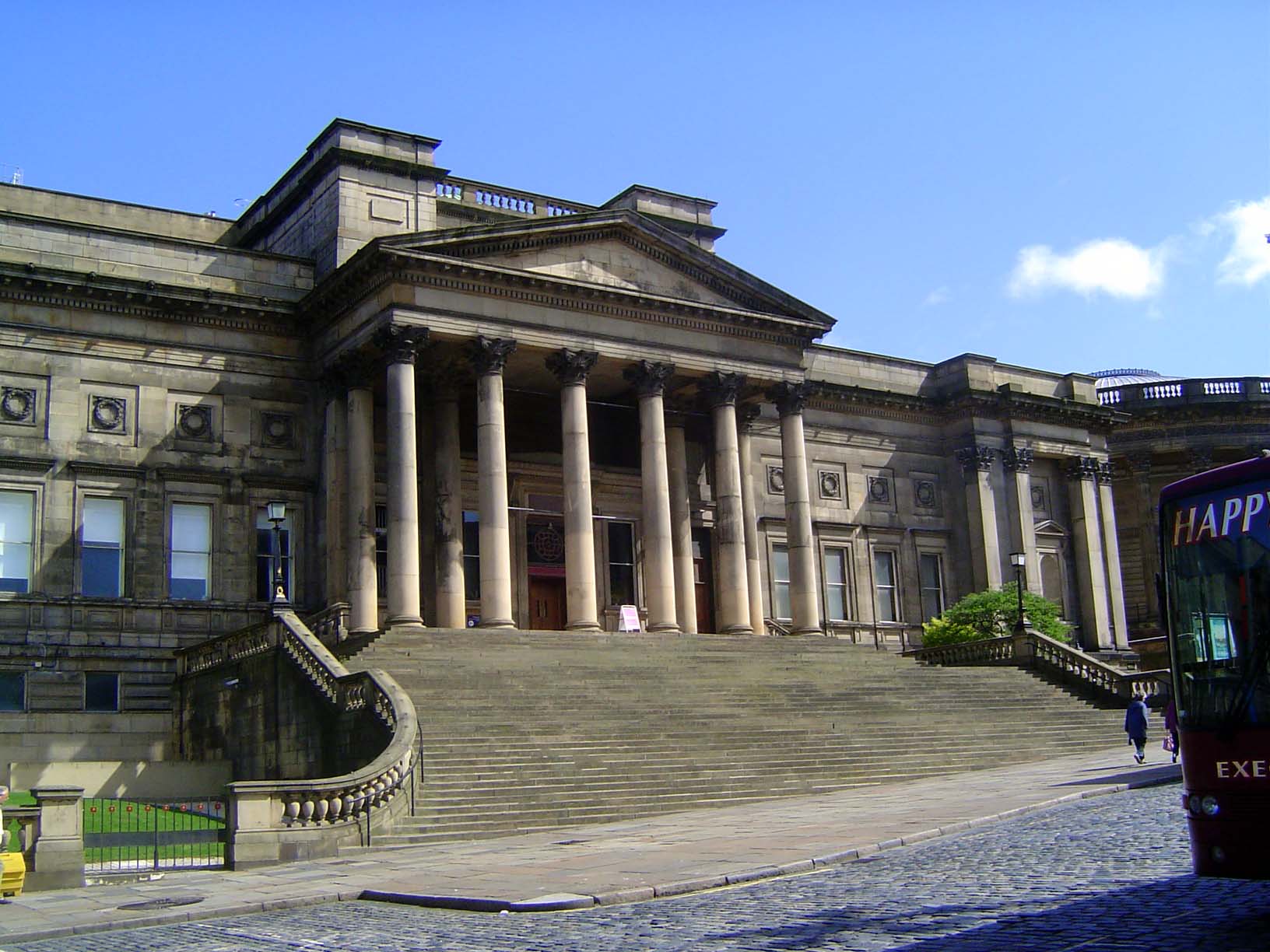 A few blocks farther east, this is the city library, paid for by William Brown, a local businessman. The steps were added in 1902, and the b