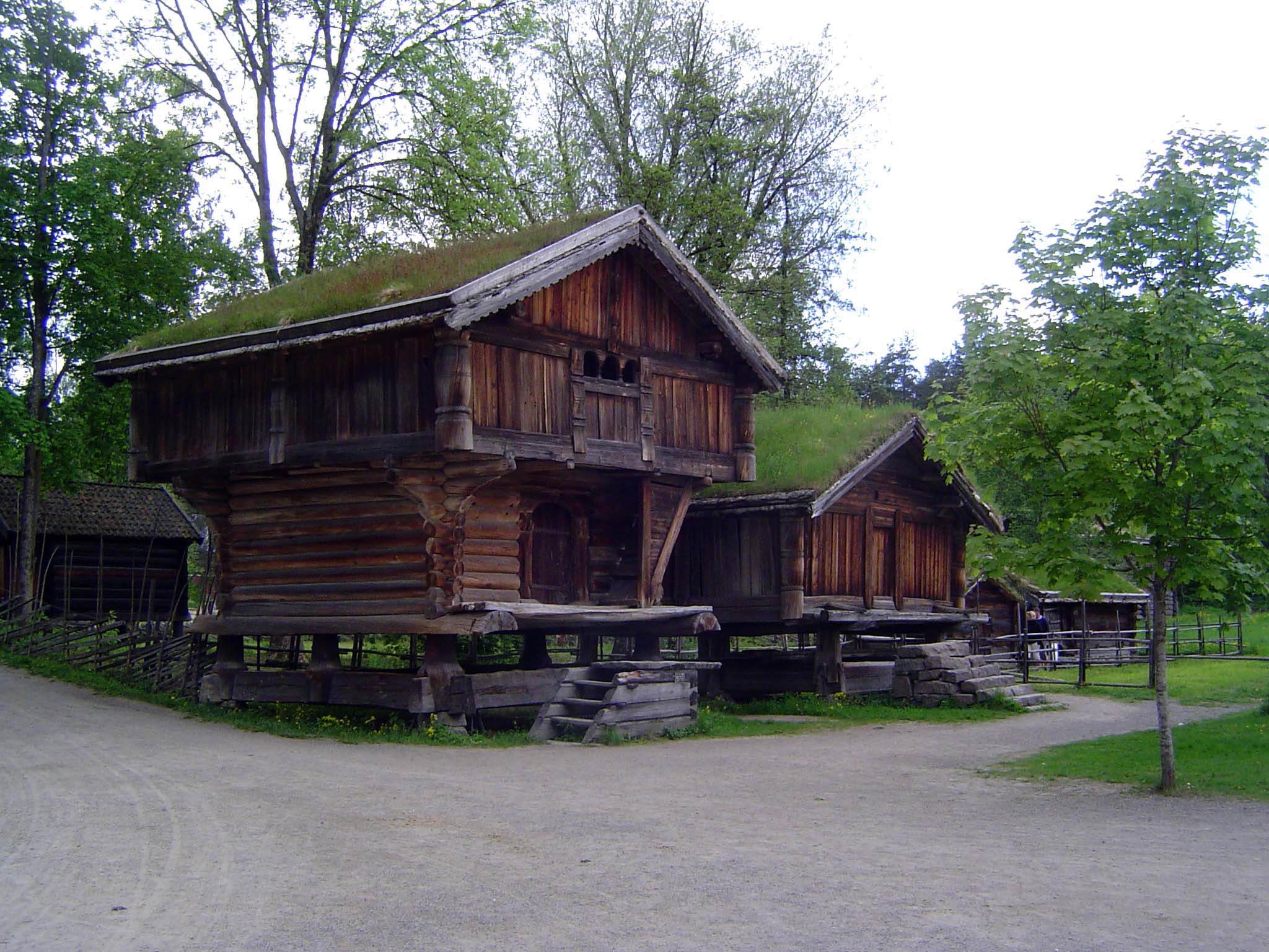 Old when that milepost was young: a loft from about 1300, judged by the round logs, notches, and runic inscription. There was a bedroom upst