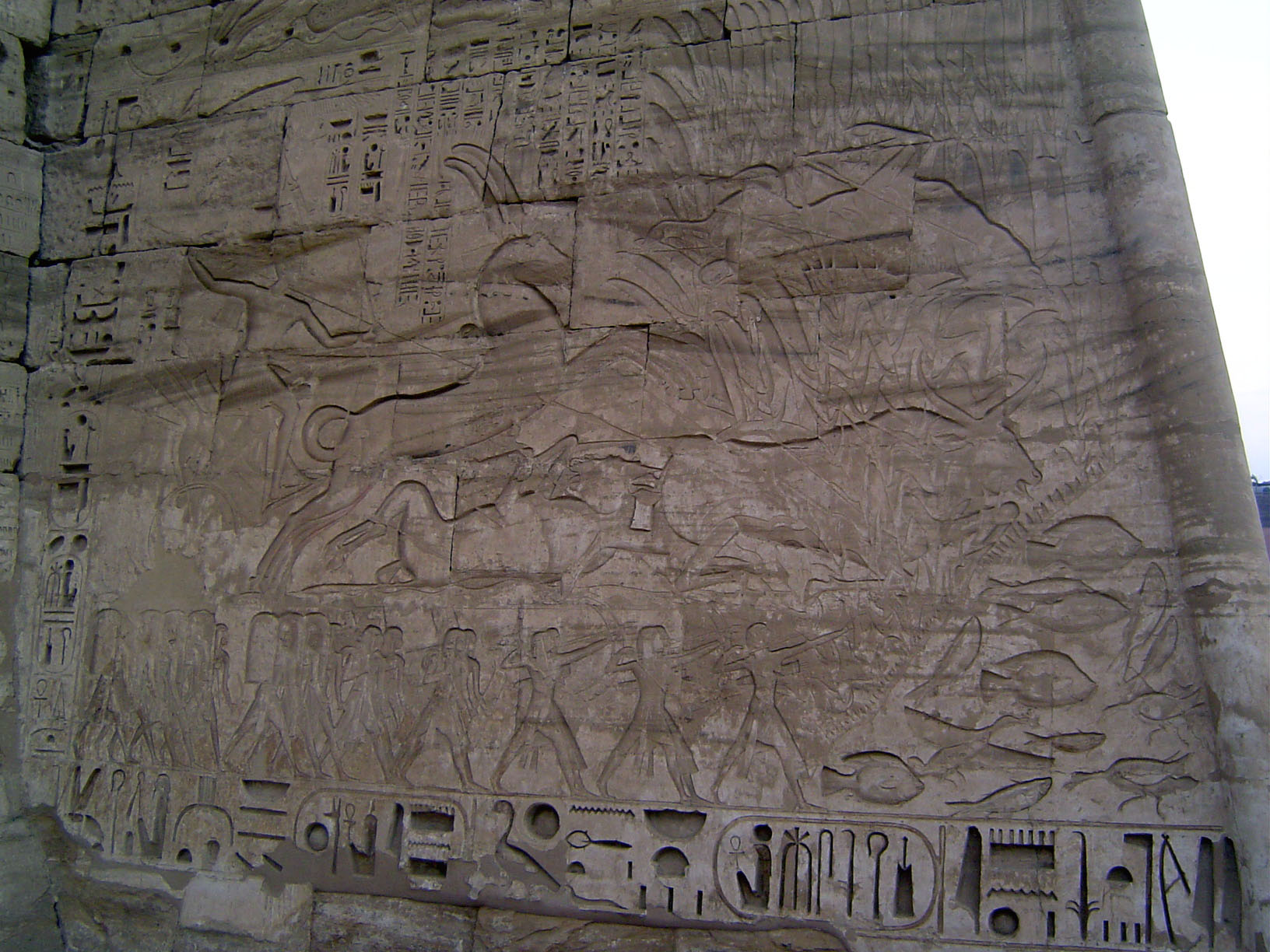 A famous picture here shows a royal hunt, with pharoah in his chariot killing bulls in the marsh. Fish and birds in lower right suggest the