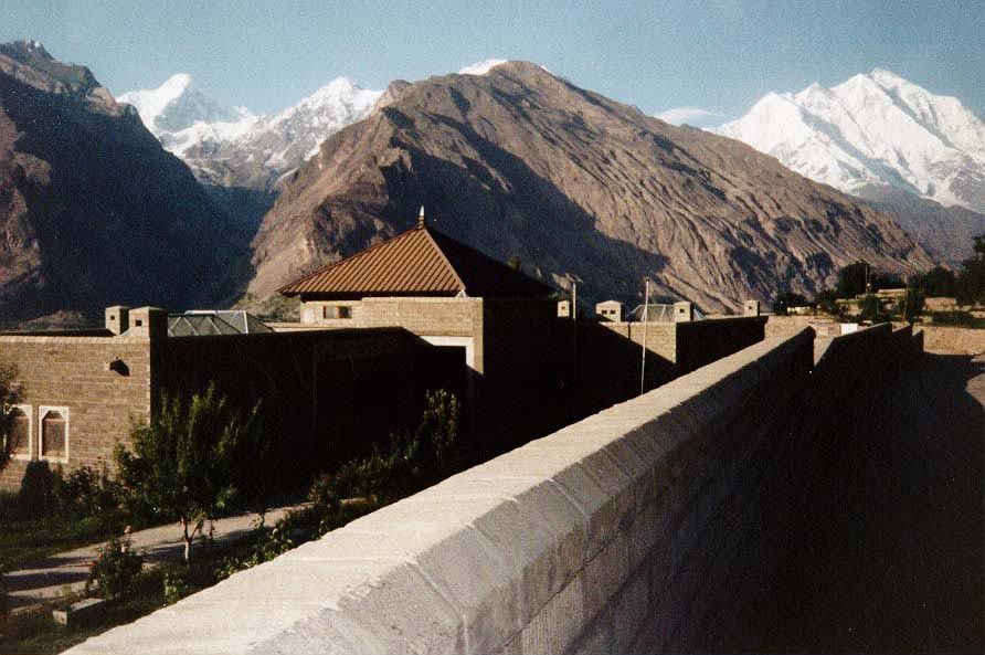 A school funded by the Aga Khan Foundation has sought a compromise. The building is constructed of blocks colored to match the hills beyond.
