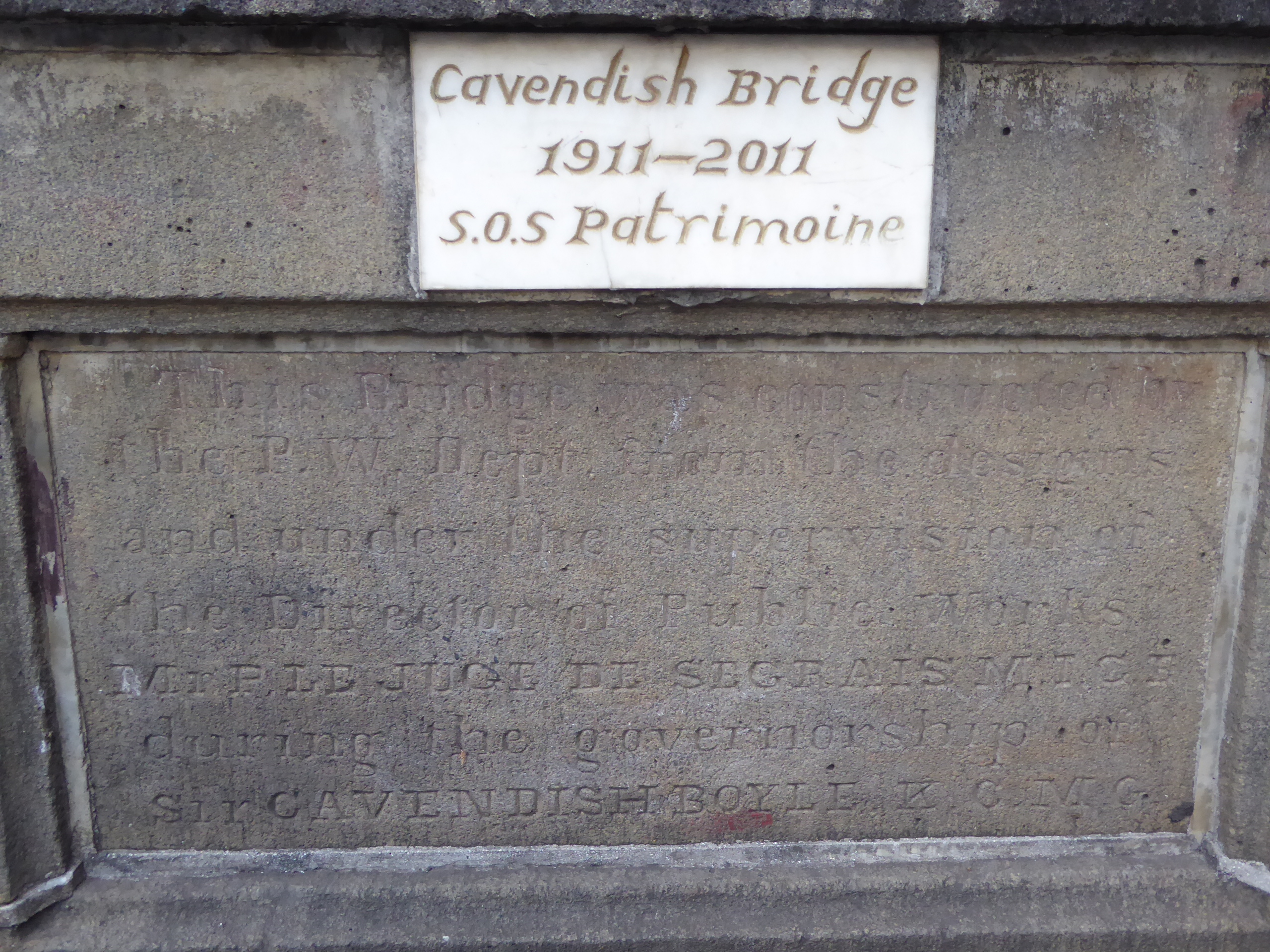 Hard to read? "This bridge was constructed by the P.W. Dept. from the designs and under the supervision of the Director of Public Works, Mr.
