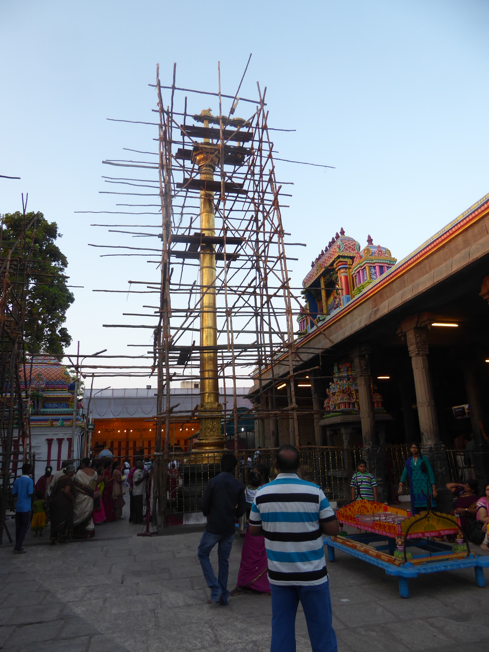 A brass lamp-column stands outside the main Shiva shrine.

Originally located on the coast, the temple was destroyed in 1566 by the Portugue