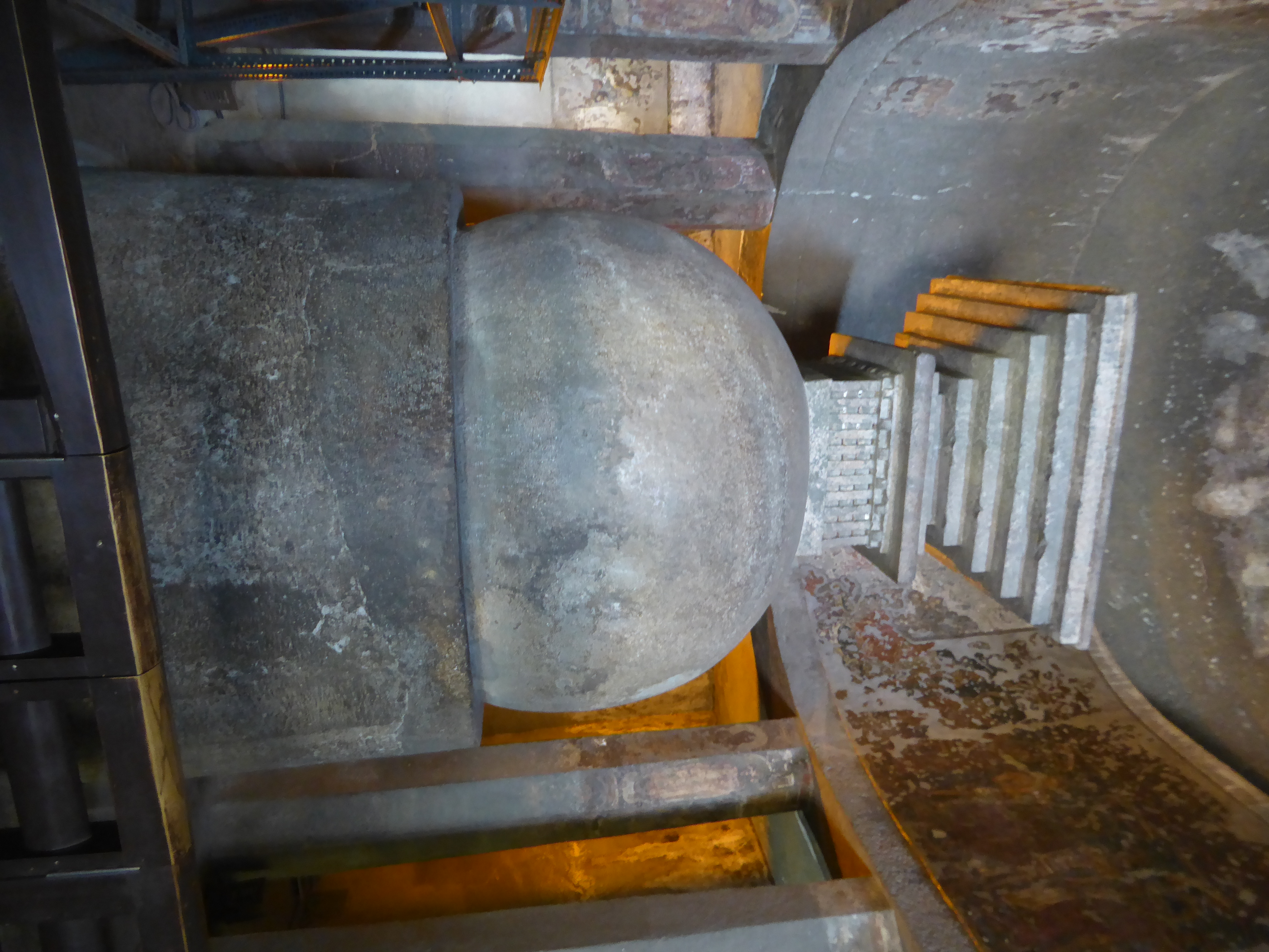 The focal point is a stupa of five parts. The base is the medhi. Above it is the spherical anda or egg. Above that is the relic box called t