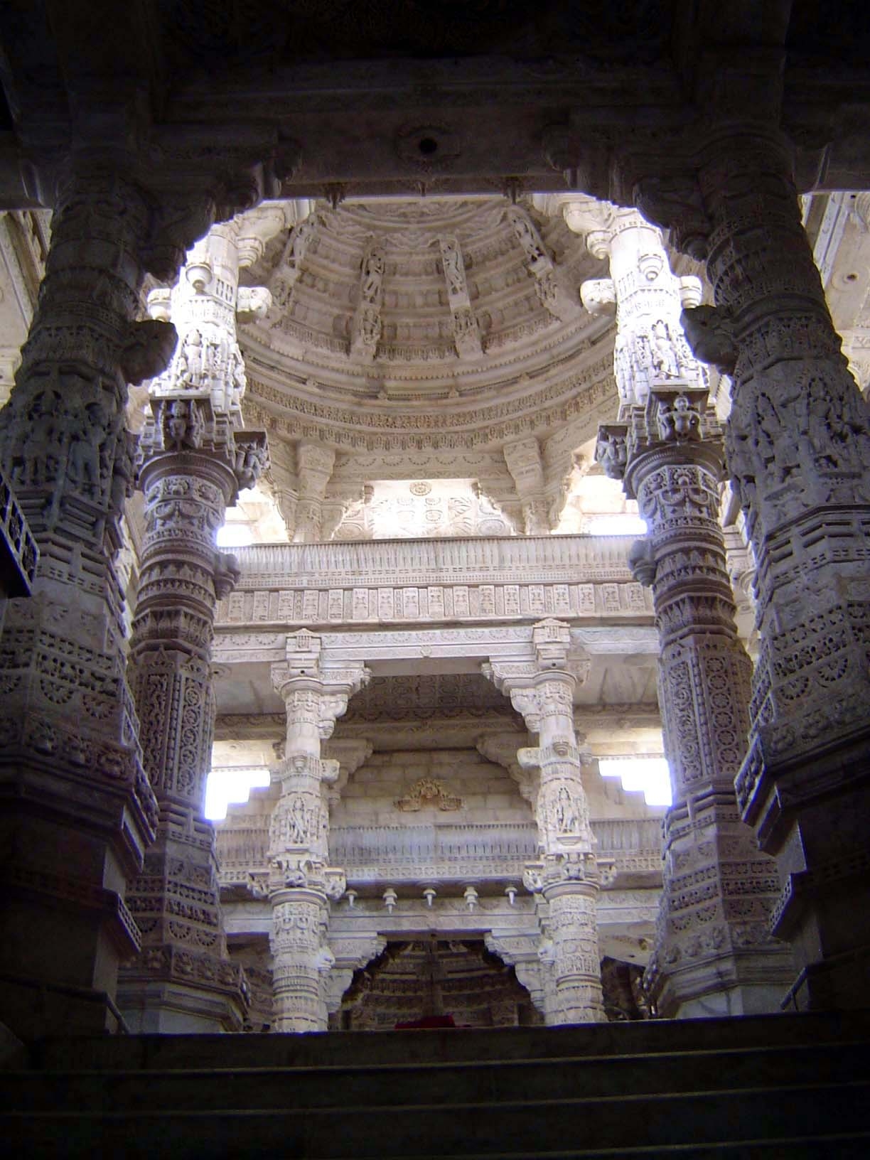 Between the entrance and the central shrine is a mandapa or columned hall with, in this case, three levels. The dome is false—corbelled—not
