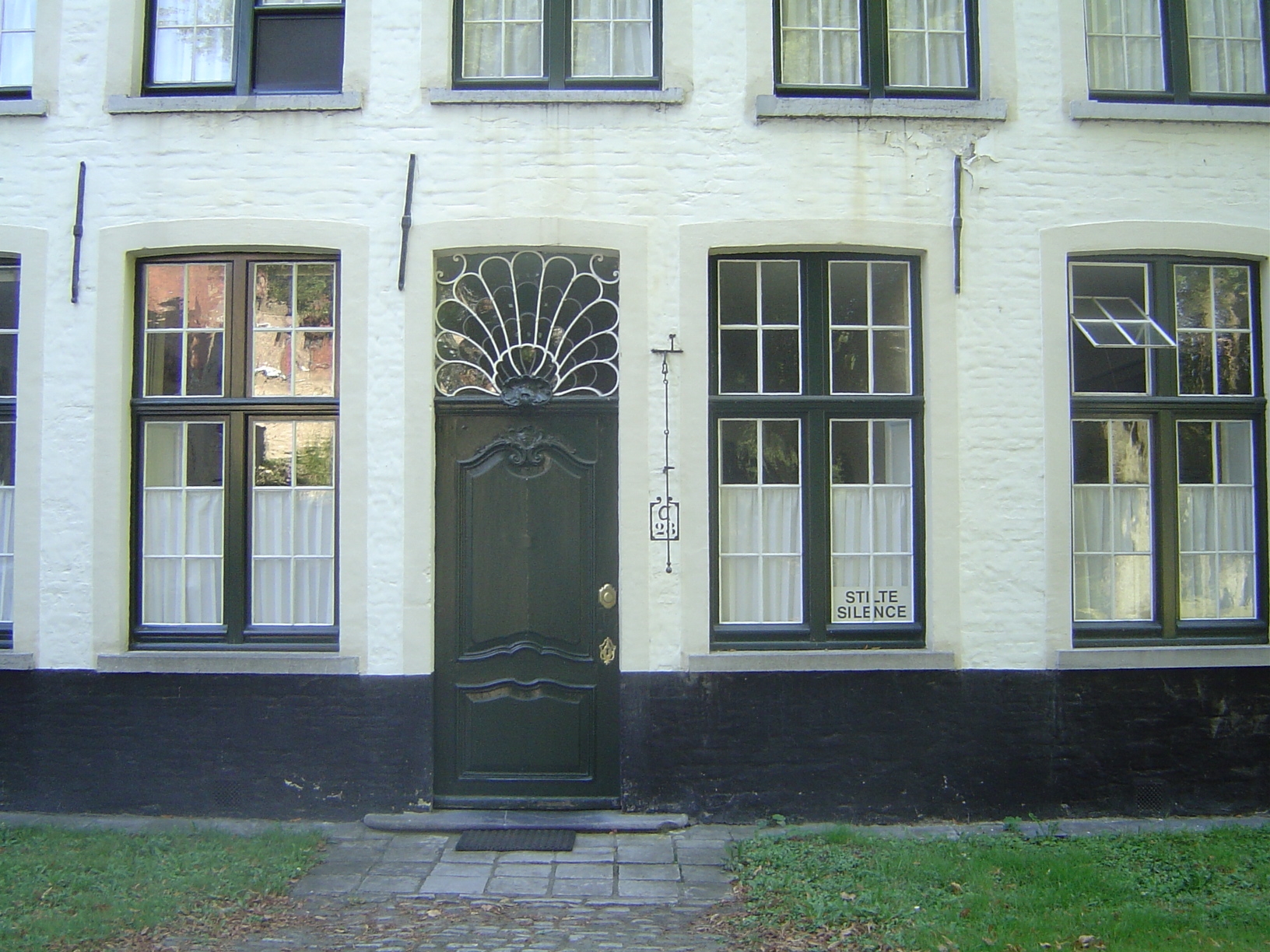 The "silence" is forbidding, but the window over the door is nice. The buildings themselves date from the 16th century; until 1900, when the
