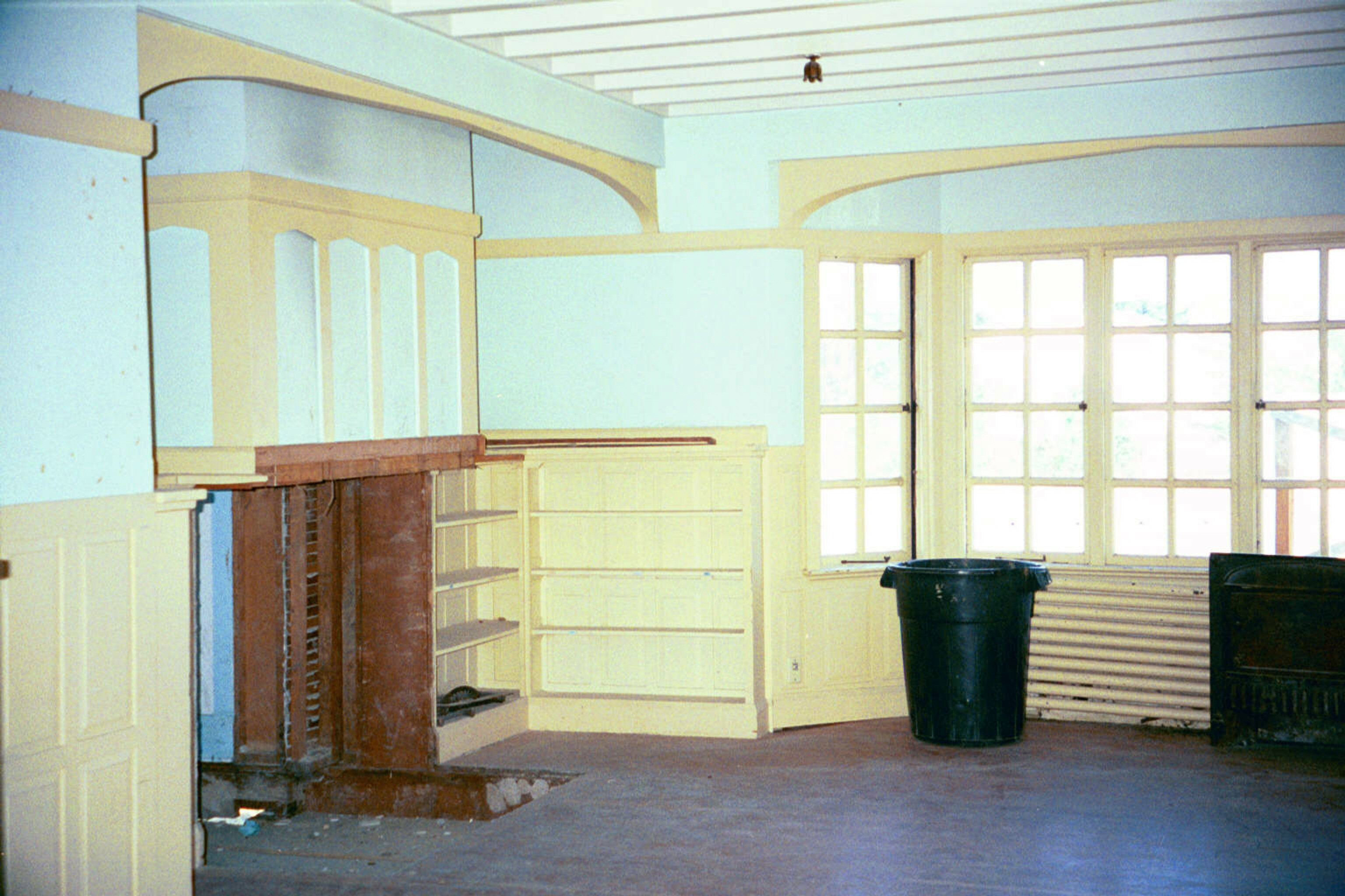 The living room, looking over the water. The fireplace masonry had all been removed because the house was moving.