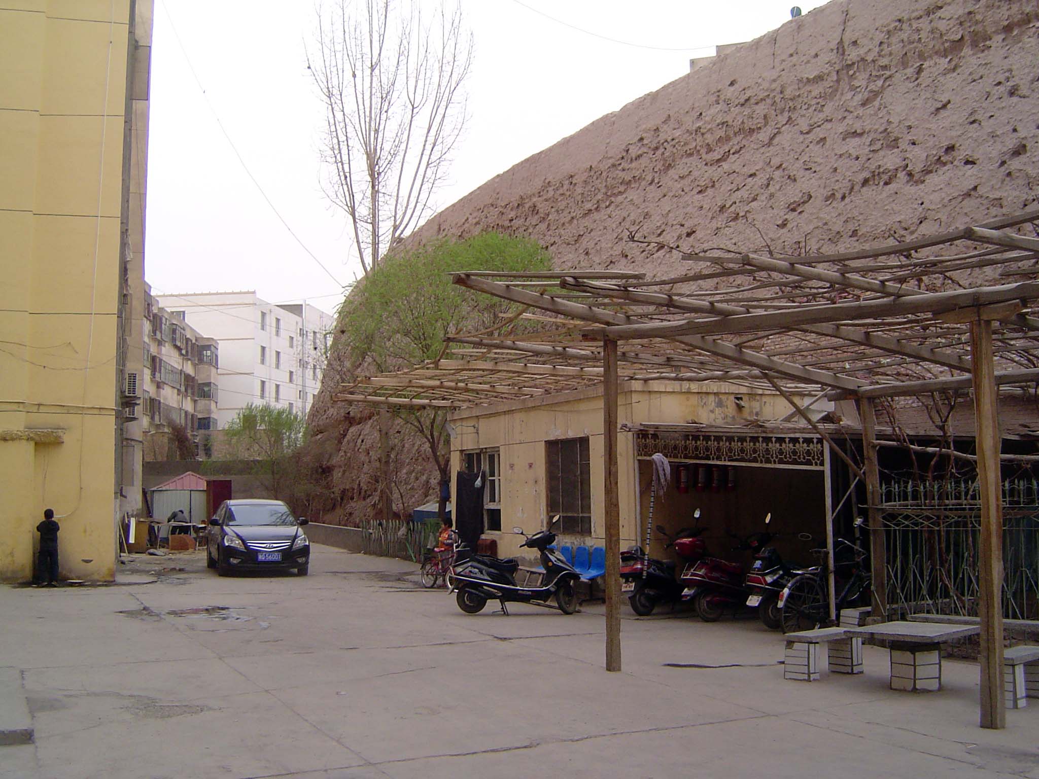 Kashgar was once walled, but only short lengths of wall remain, in this case hemmed in by housing blocks whose residents probably see the wa