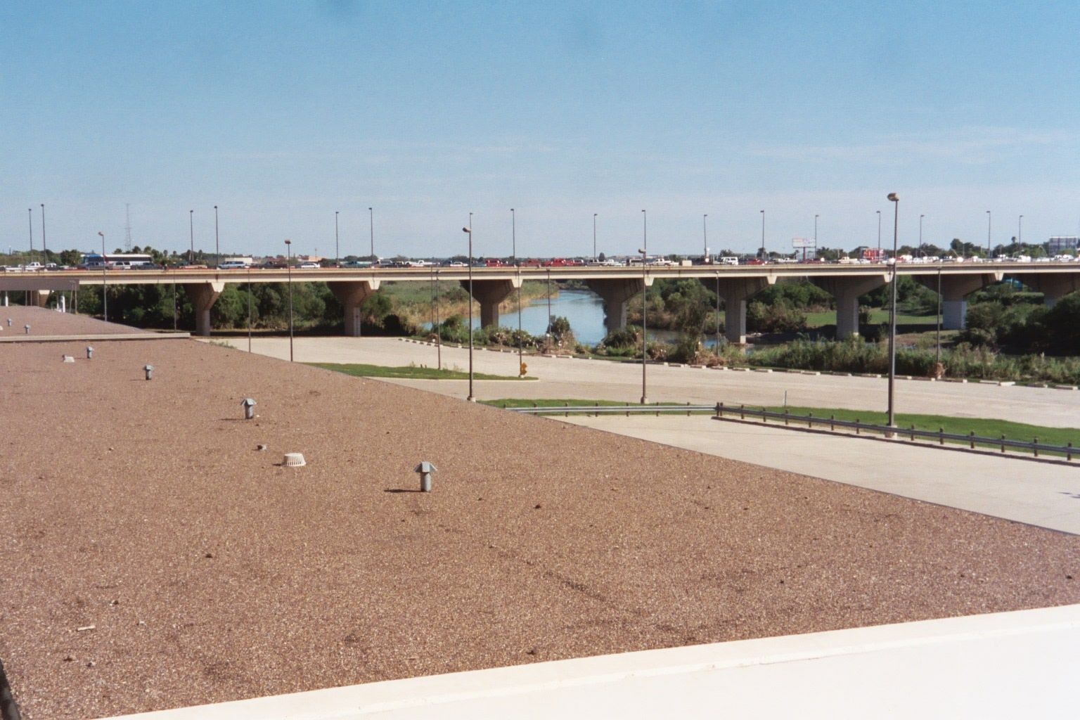 It's that border that makes Laredo. The bridge is International Bridge No. 2; the parking lot is now closed but once was for truck customs.