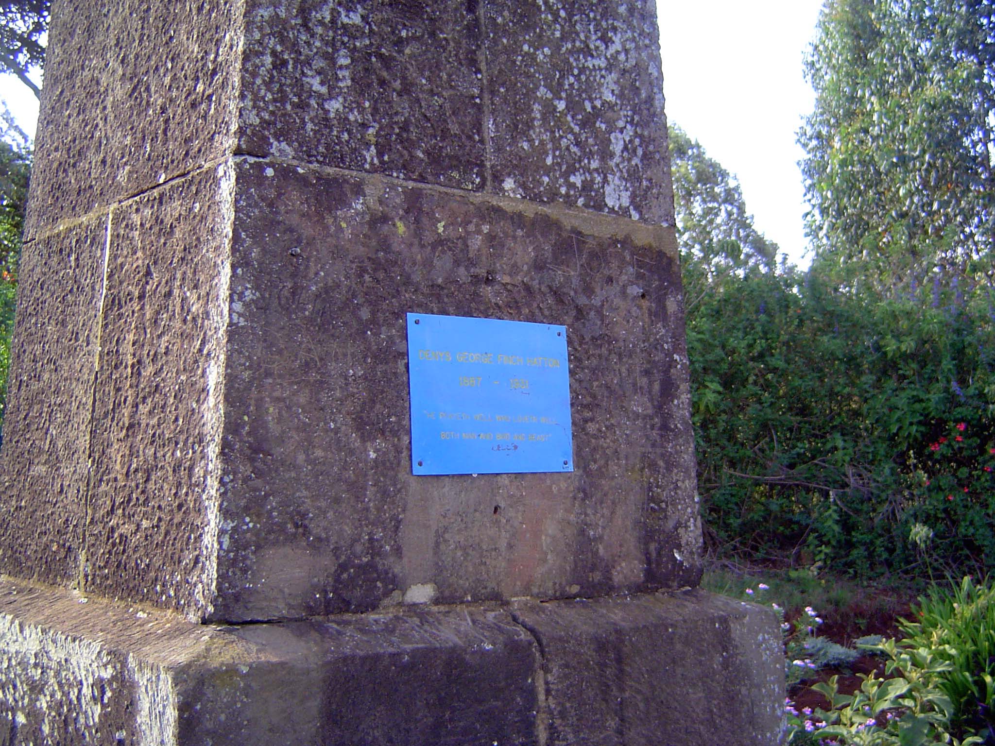 The original plaque was swiped, and the site's owner has replaced it with a simpler one. The inscription is unchanged. The quotation is from