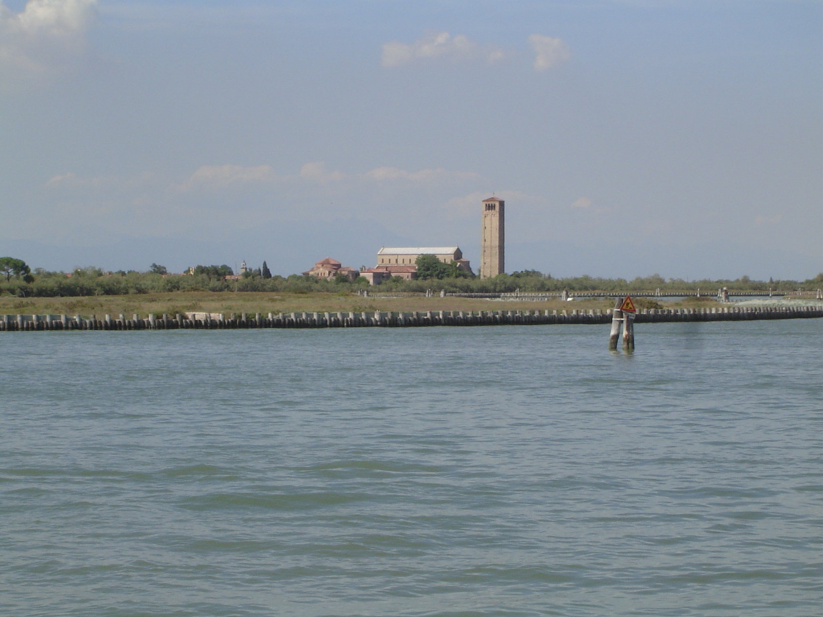 Here's Ruskin on Torcello, the island on which a church was established in the earliest days of Venice.

"Seven miles to the north of Venice