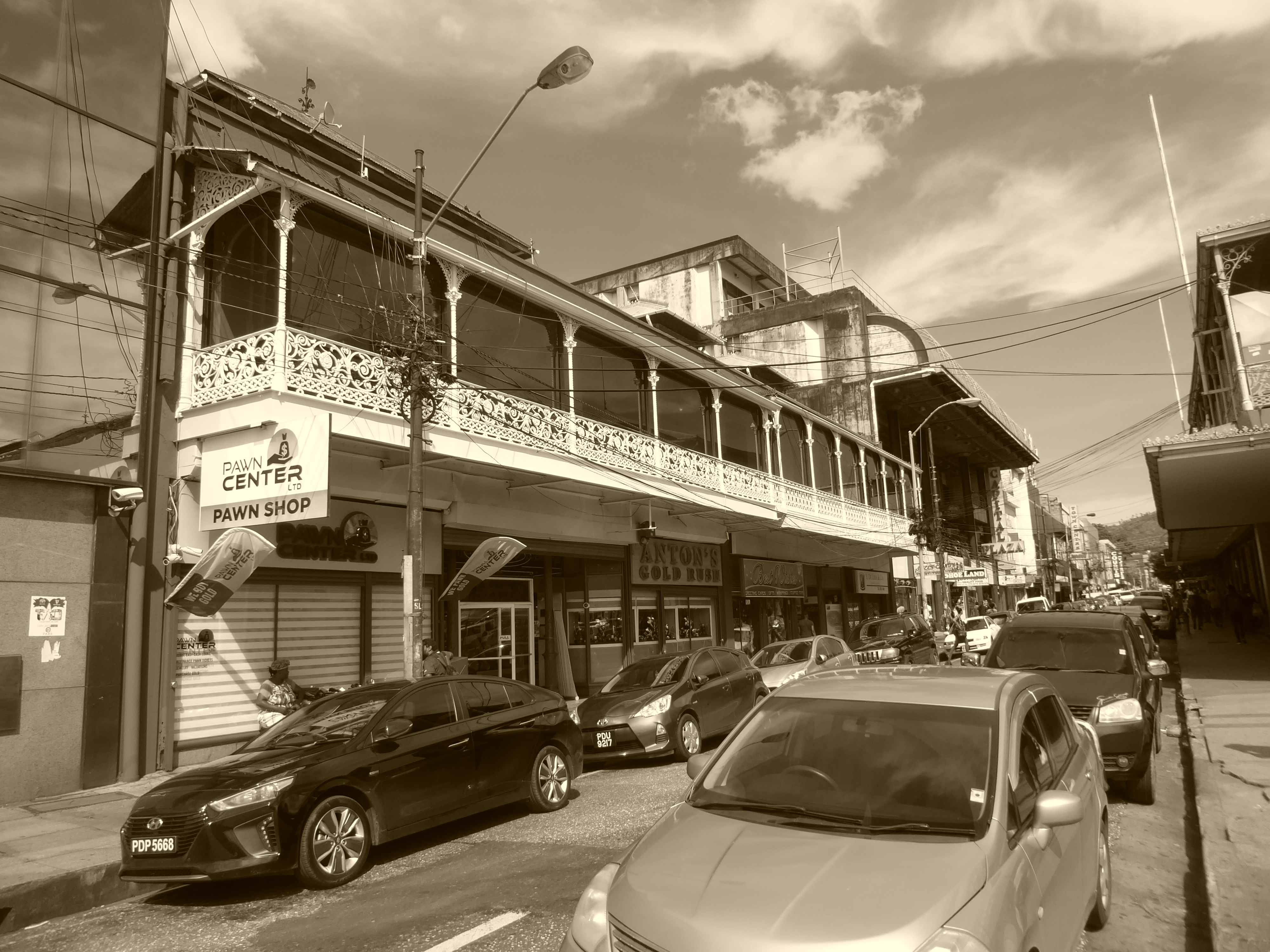 The old commercial core was gridded with mostly narrow streets and buildings designed for the weather. Most of those old balconies have been