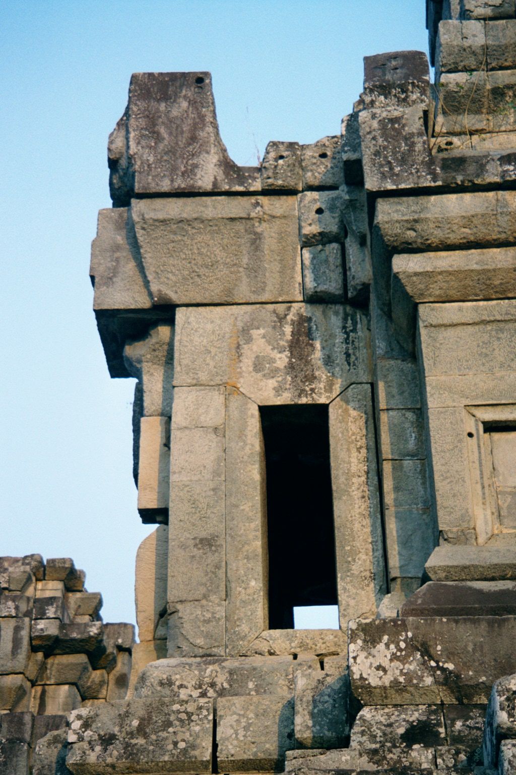 Although the effect is accidental, the unfinished stone is attractively free of the explicitly political messaging of the Bayon.