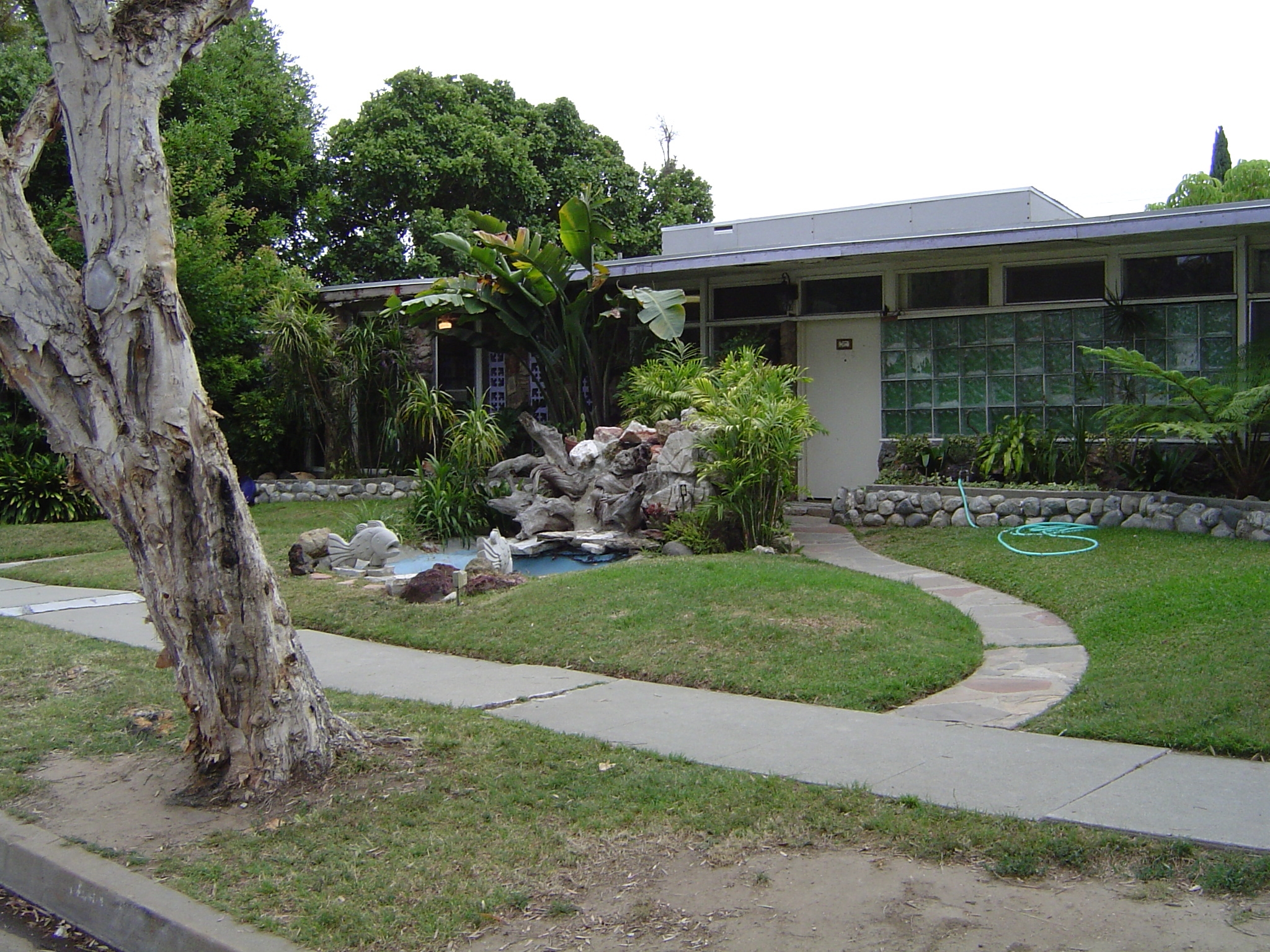 The most interesting thing about these homes, which on the face of it are crushingly identical, is that landscaping has given them much more