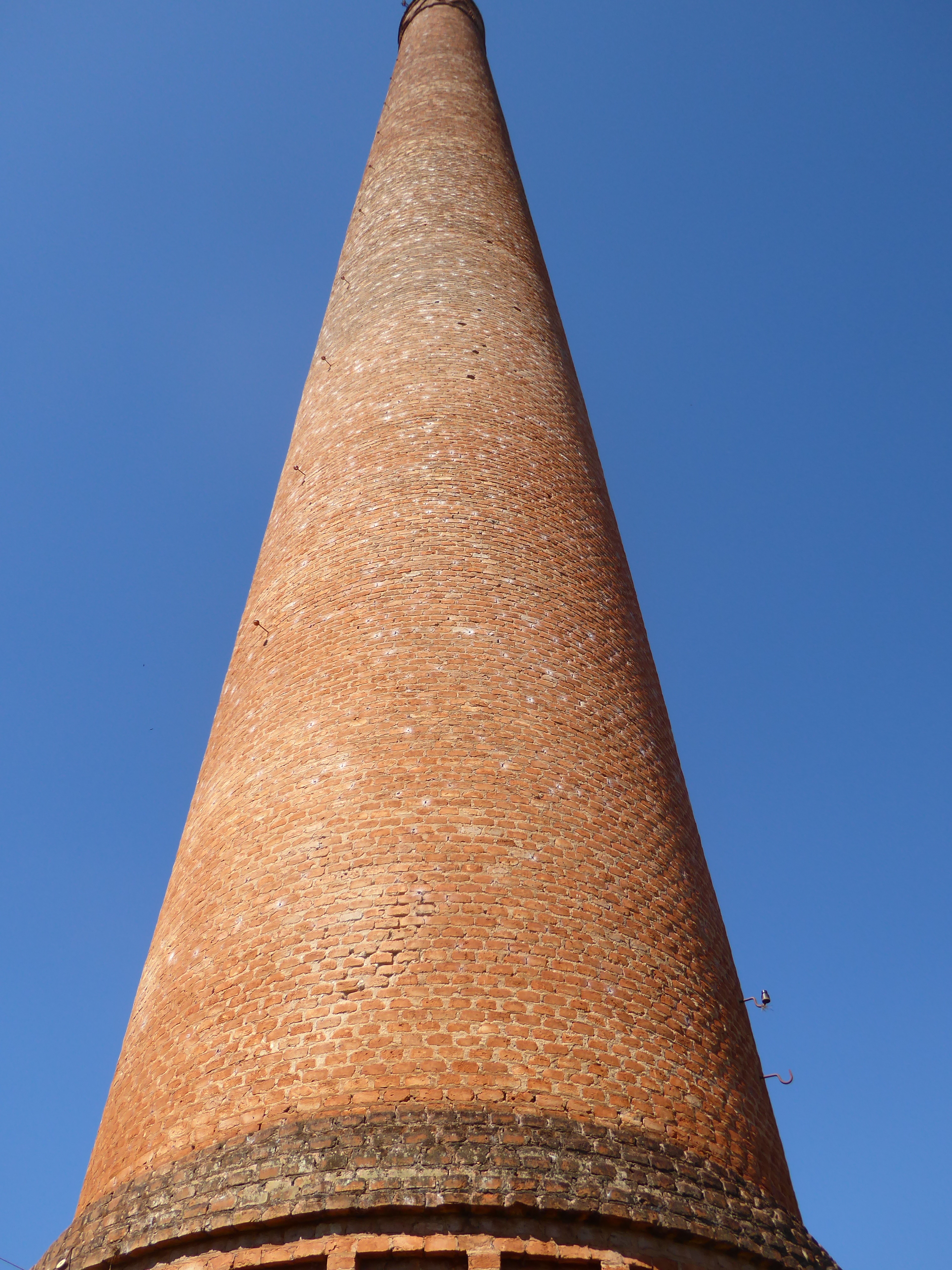 Funny thing: it's a warm day, but there's a cool breeze blowing stiffly from the base of the stack.