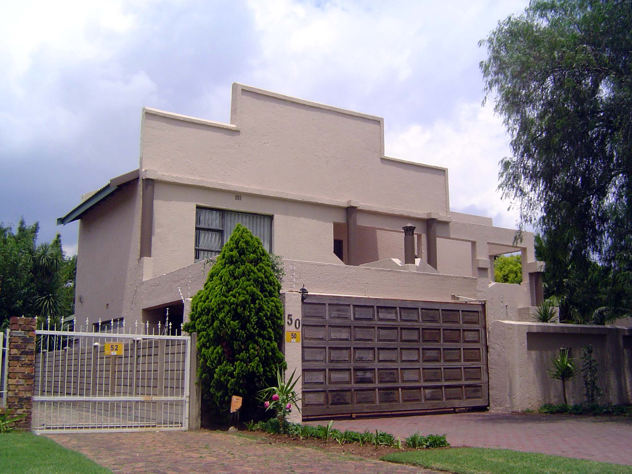 A house that presents an electrified wall to the street. The house itself does a fair imitation of a bunker.