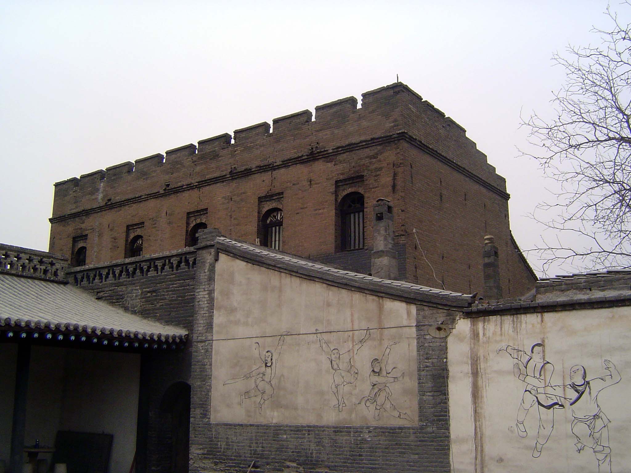 An exception to the rule: this unusual, European-styled building housed the Chinese Armed Escort Agency. Hence the murals surrounding the co