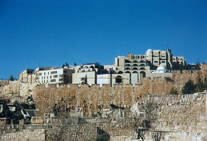 The Jewish Quarter, completely rebuilt from the rubble seized in 1967, rises here over the southern wall of the city. The first houses that