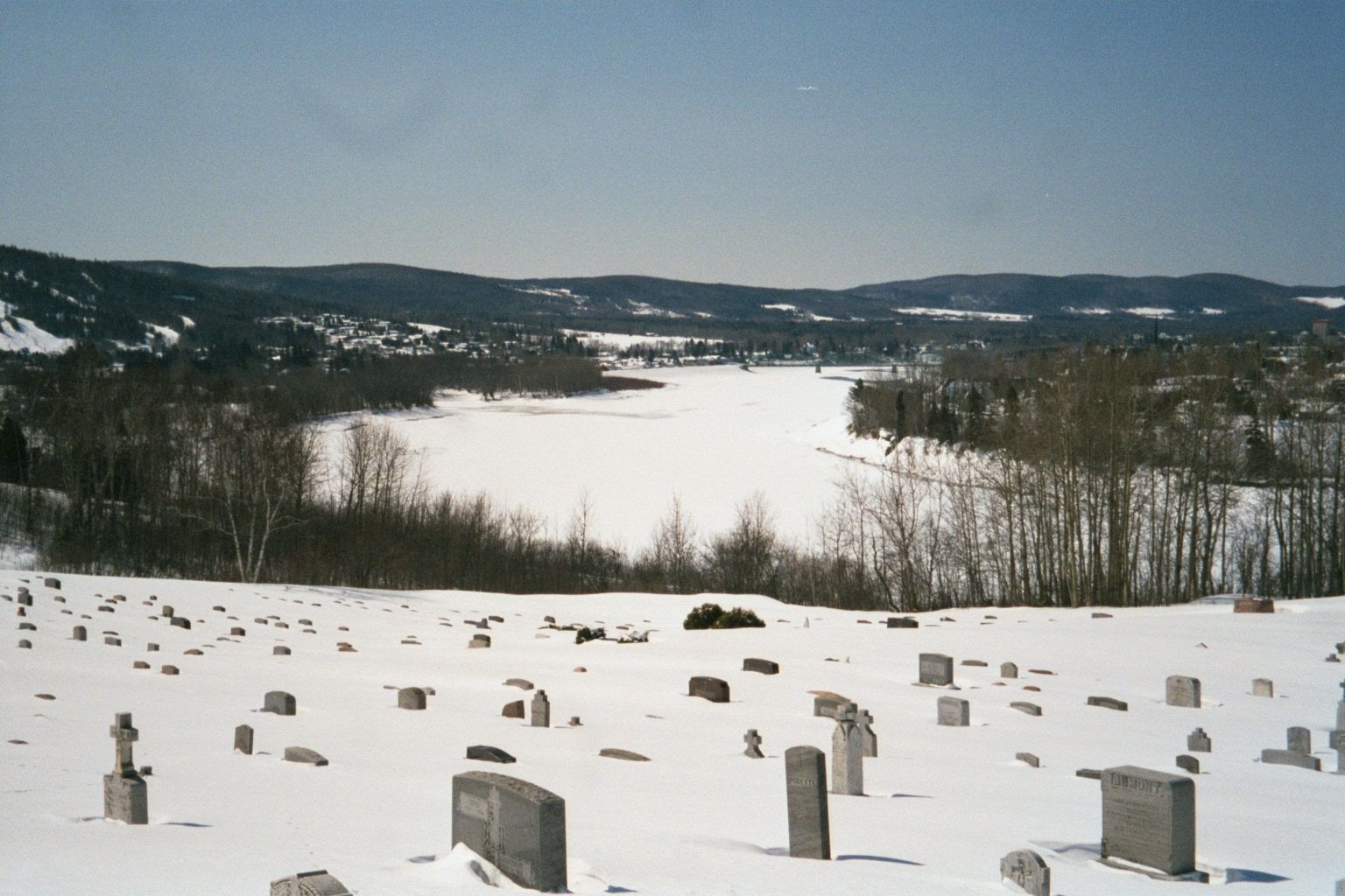 Rivers, roads, houses, barns.... Time for a cemetery in the snow. People who die in the winter are buried in the spring, after the ground th