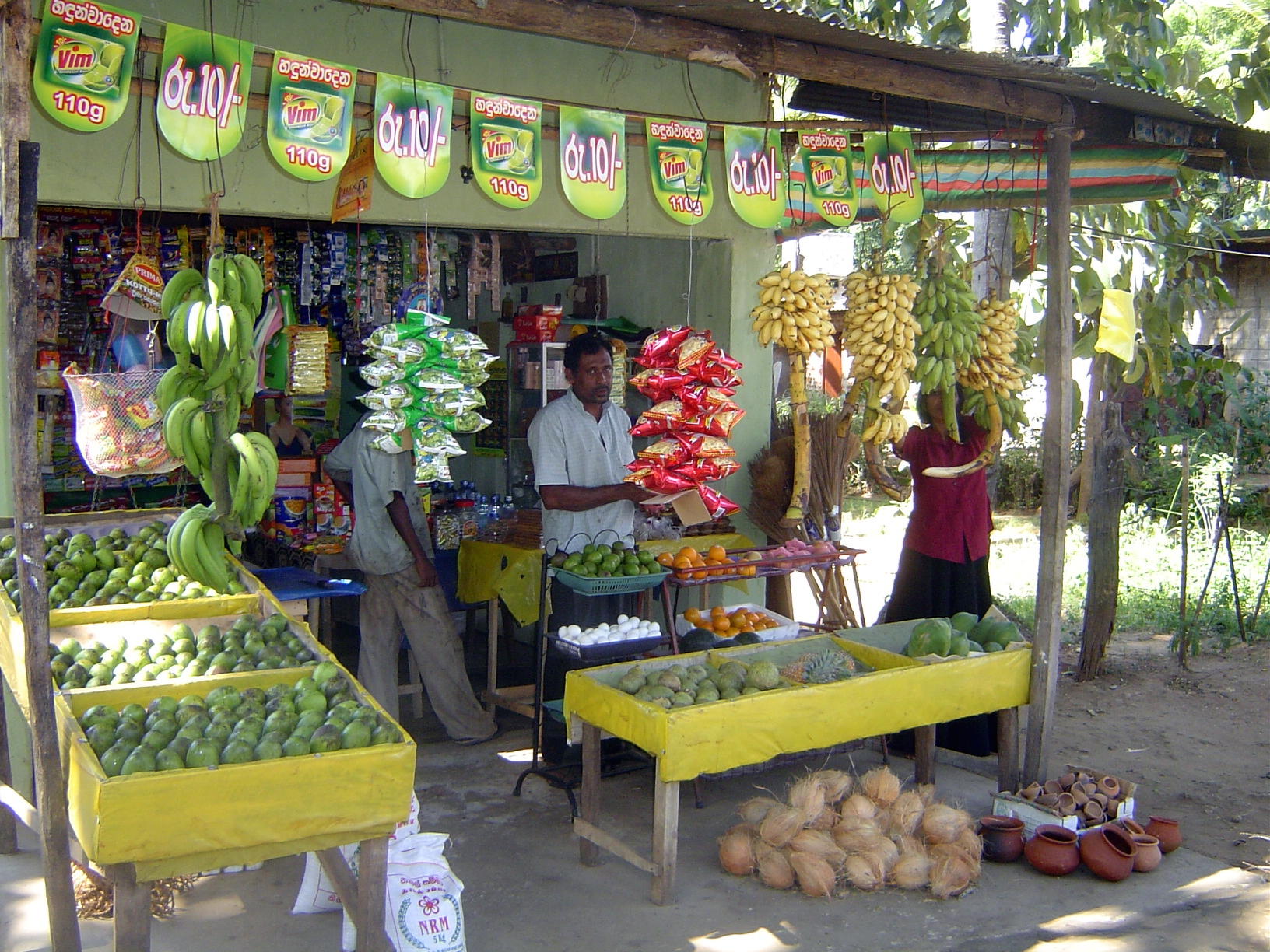 Up the road, at Tambuttega, this merchant has apples from China. That's a testament to modern logistics and rising incomes.