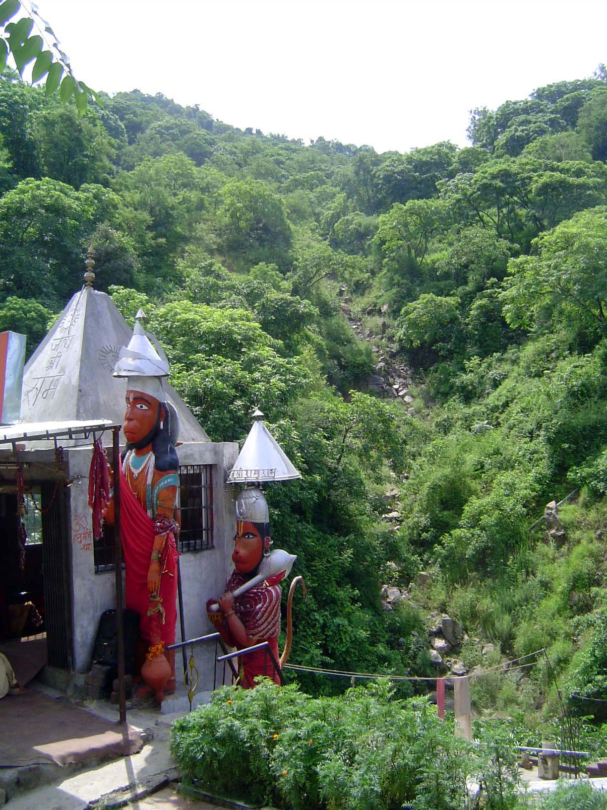 A temple and old road below at the foot of the mountains.