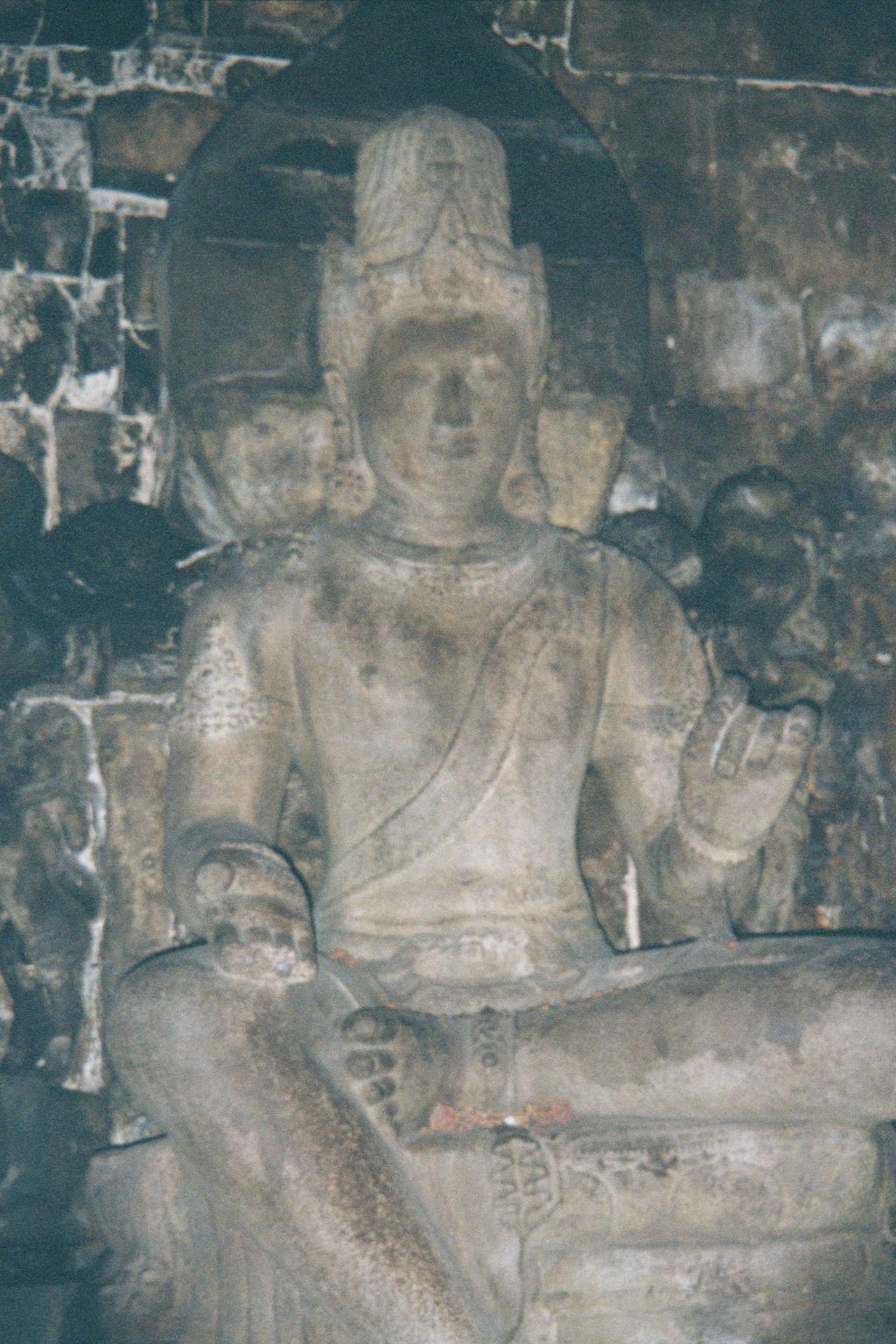 On the other side, Vairapana, or Vairocana, the teaching Buddha.