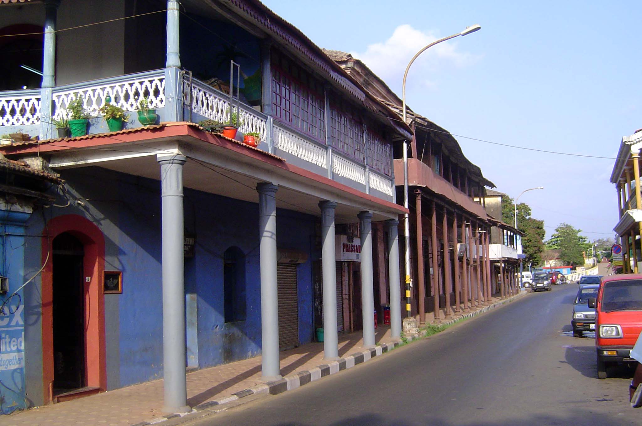 A late vintage is suggested by the use of iron columns. White paint is reserved for churches.