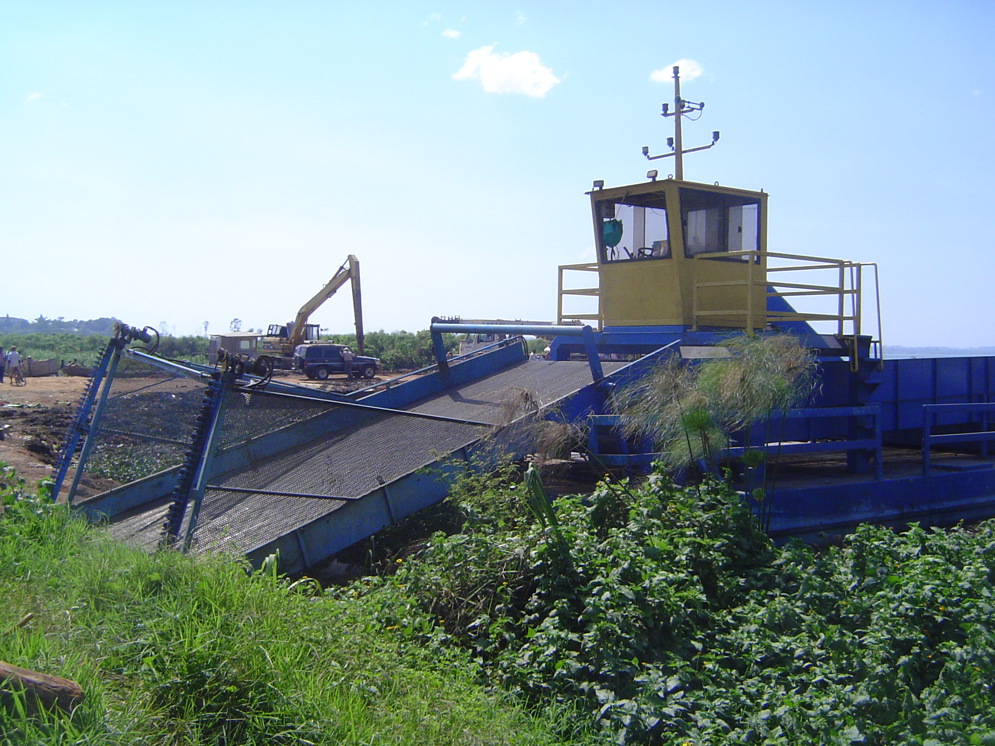 Here's your answer: an aquatic weed harvester, resting for the moment but girding its loins for the task.