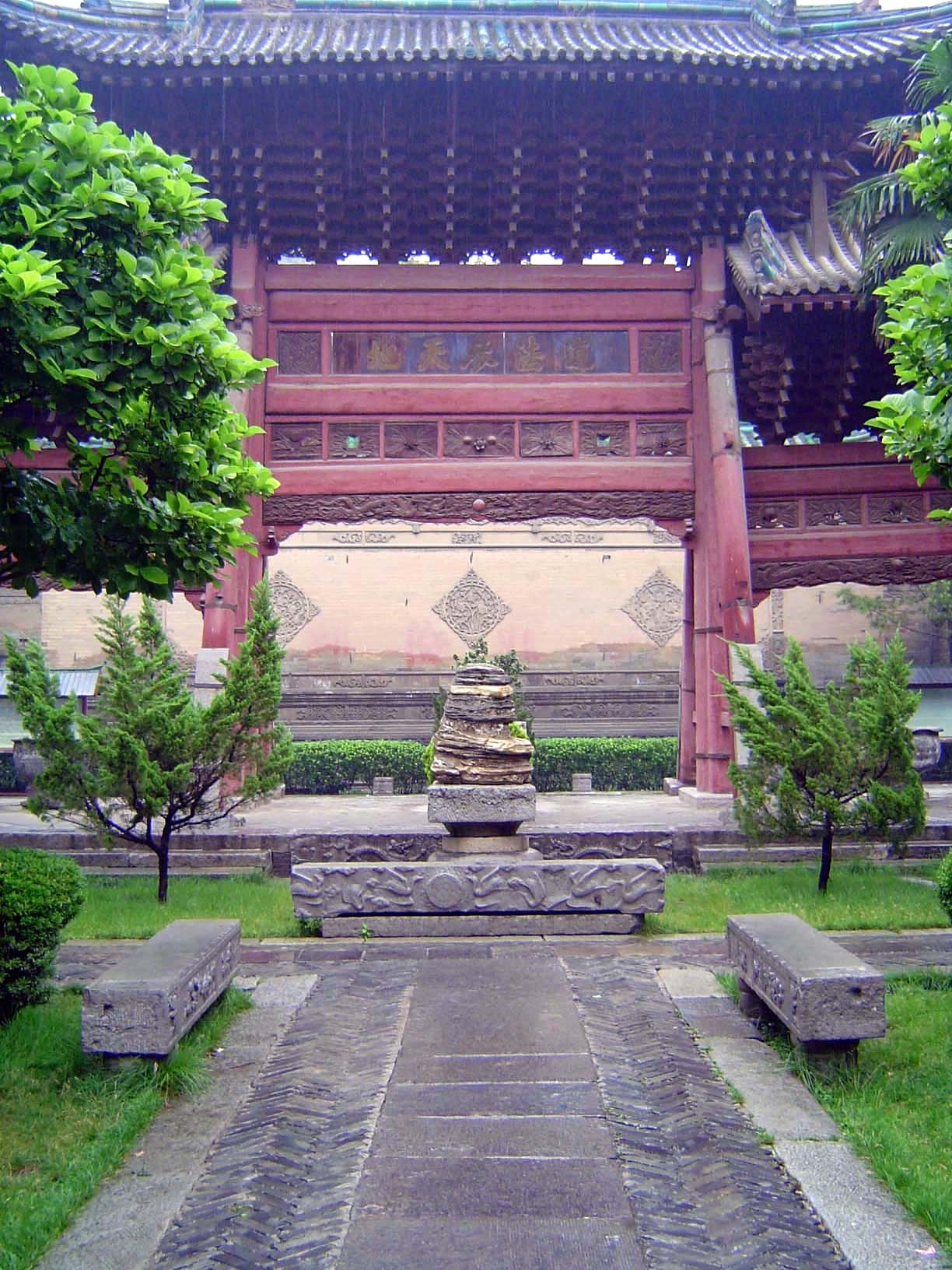The view back through the gate to a screen wall. Normally, such a screen wall would block the view from the street beyond, but in this case