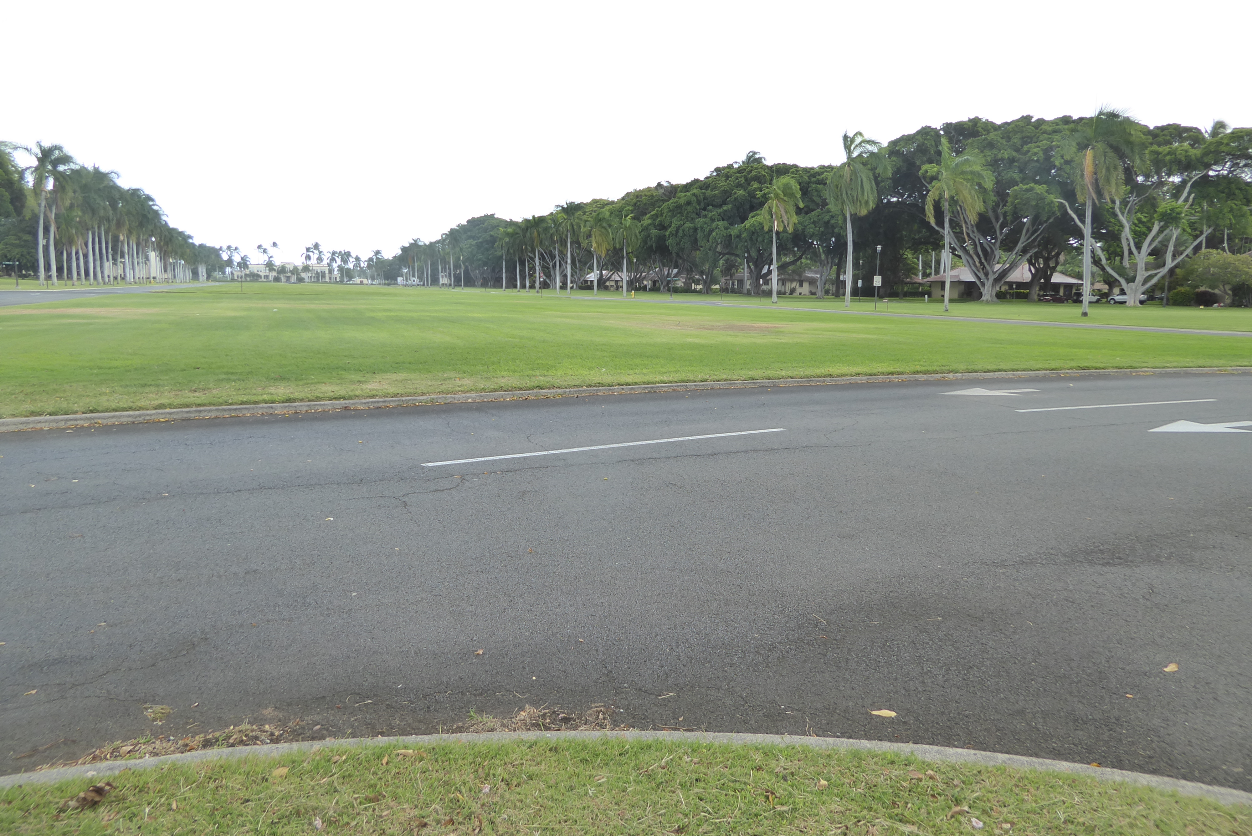 The tower stands at the toe of a parade ground separating homes for officers and enlisted. At the Far end of the lawn is the headquarters of