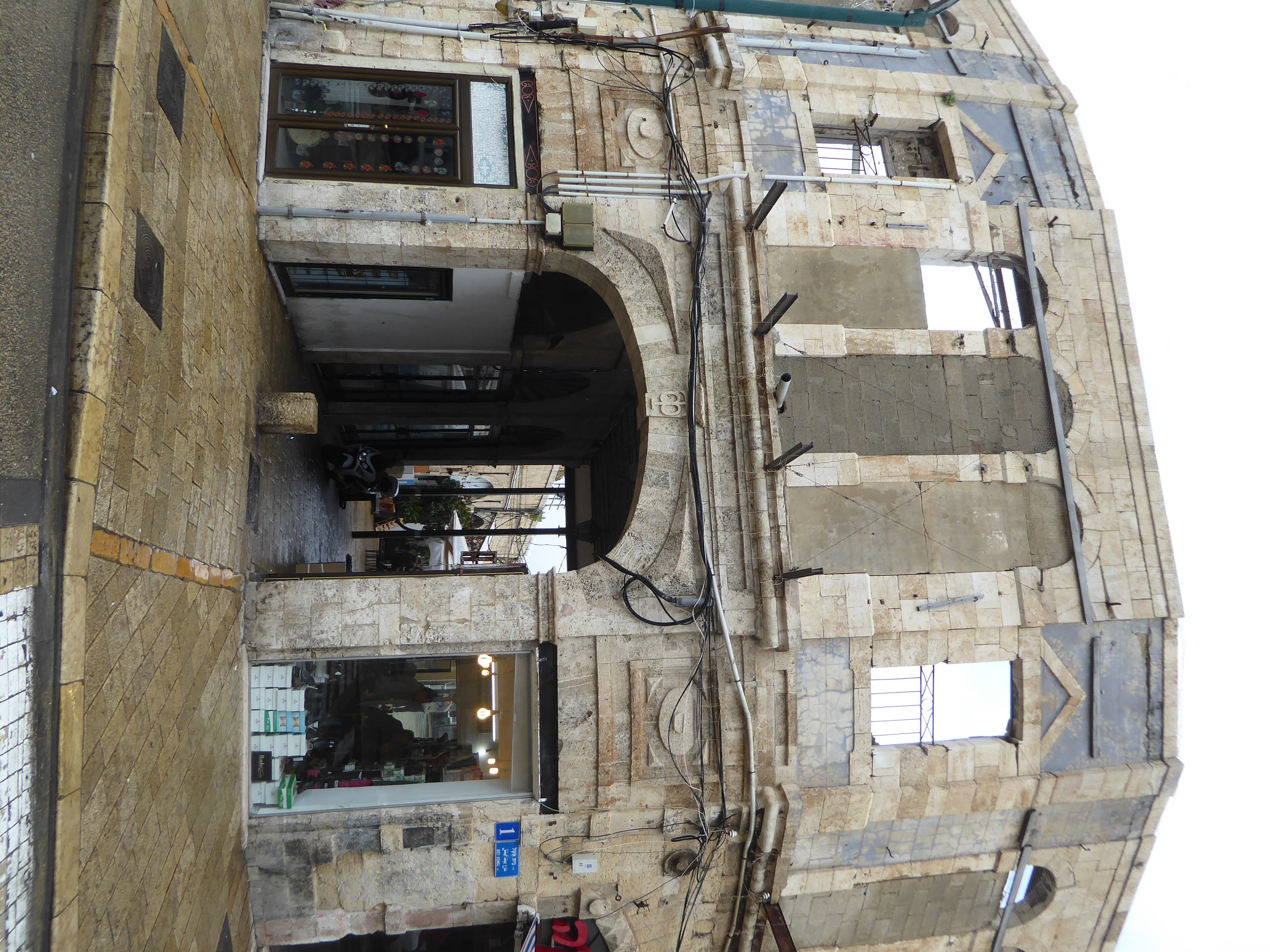 It still hints at the damage suffered in 1948.