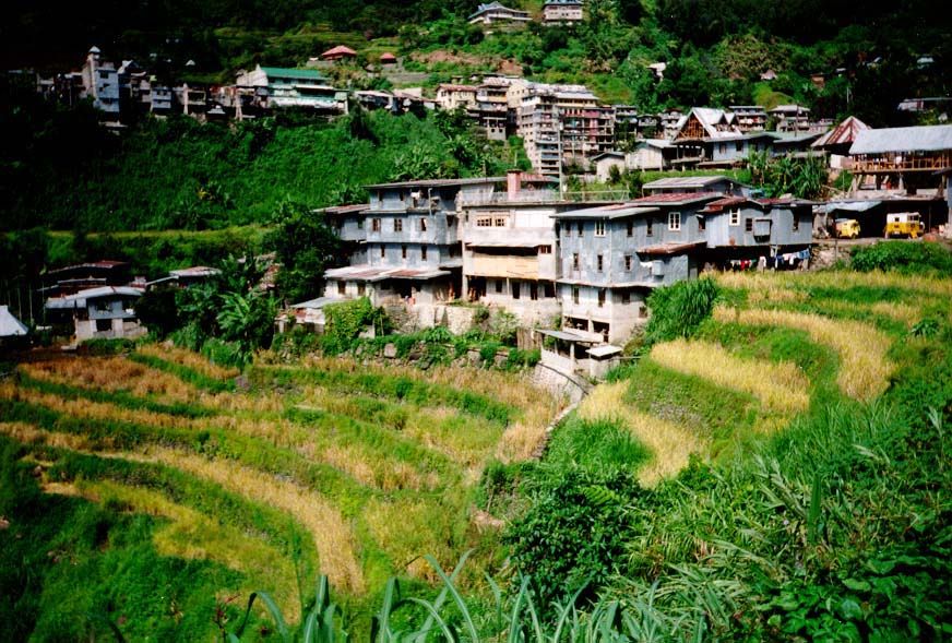 The buildings cluster around a bit of flat land occupied by many shops catering to tourists who have come to see the terraces.