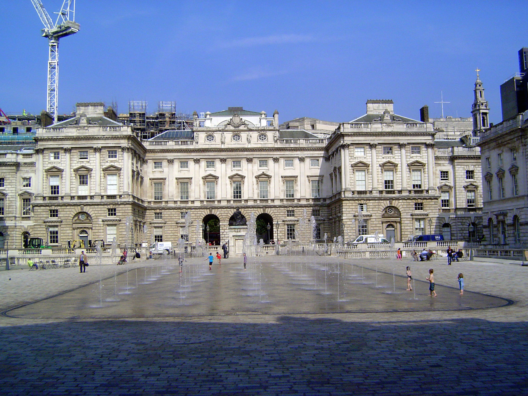 In between the two facades, there is a very large courtyard, over 300 feet square. The fountain, of course, is entirely new, from 2000. How