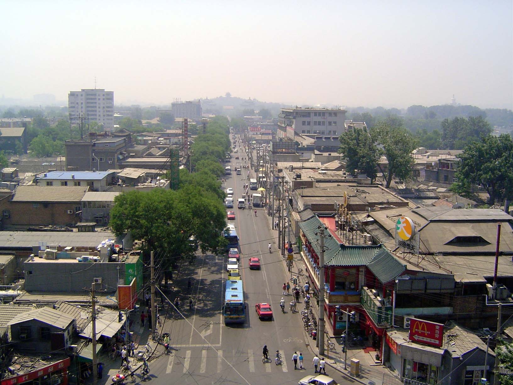 An axial street runs south to Jingshan, lost in the haze.