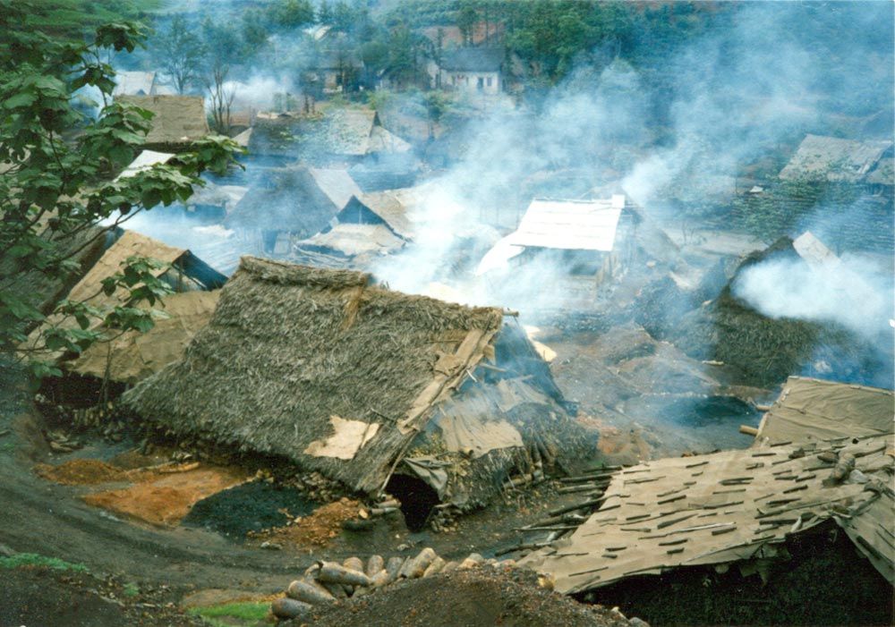 The work was done in huts like these, smoking like an inferno.