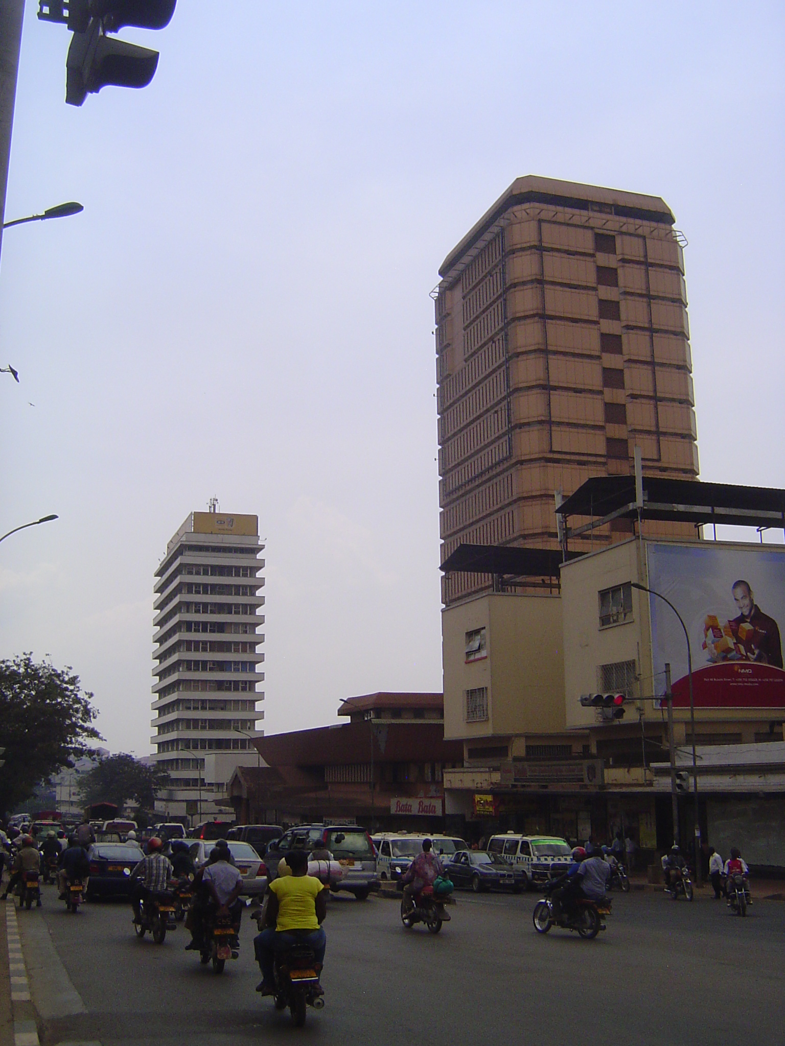 That's Uganda House on the left, built in 1980 and housing the Uganda People's Congress. The Cham Towers, on the right, were built in 1979 a