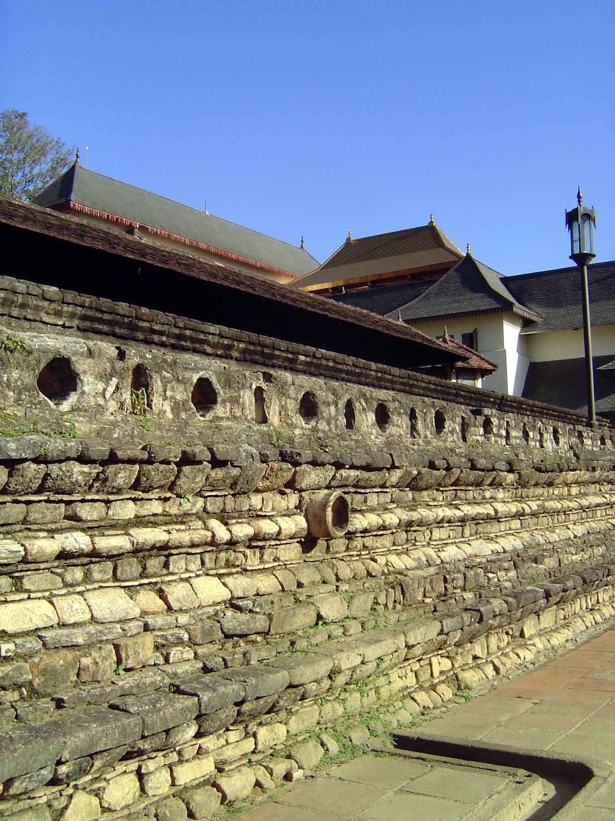 The temple wall has a classic profile. It was once plastered and whitewashed, unfortunate as that may seem to modern eyes fond of the underl
