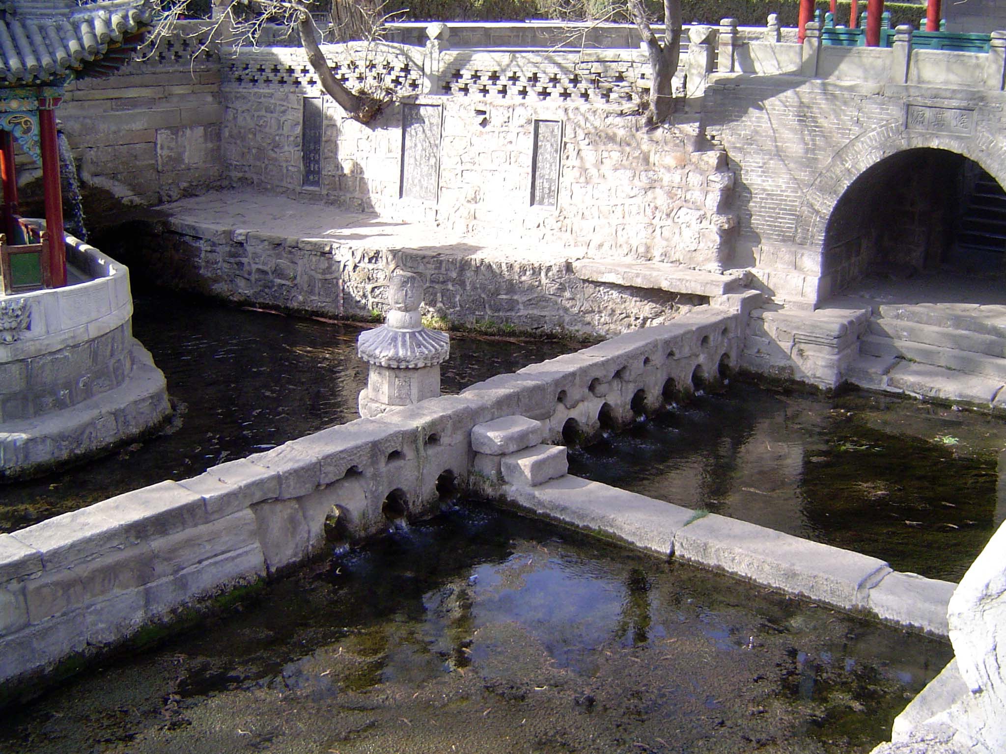 Immediately below the springs, the waters are divided into shares, physically separated as shown here by three holes to one side, seven to t