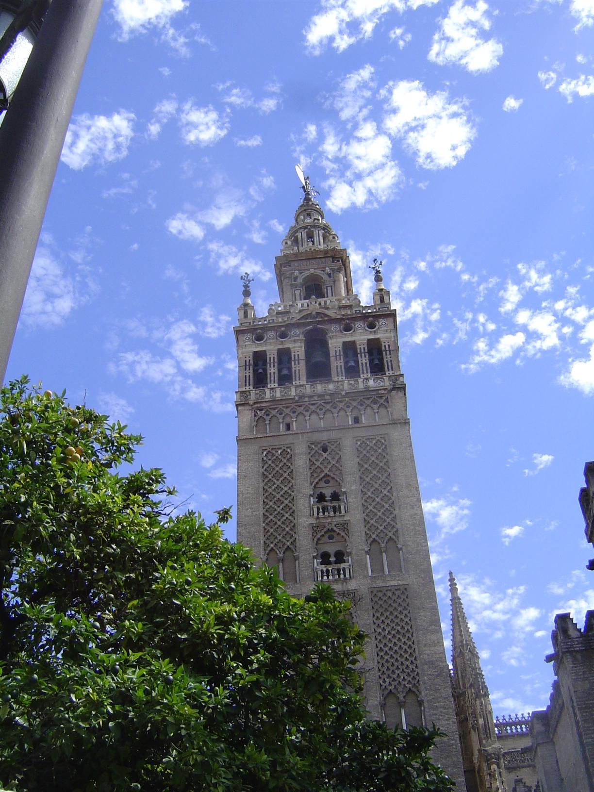 The Giralda Tower, now a cathedral bell tower, was built as a minaret. Date: 1184-96. Unlike the cathedral in Cordoba, which rises in the mi