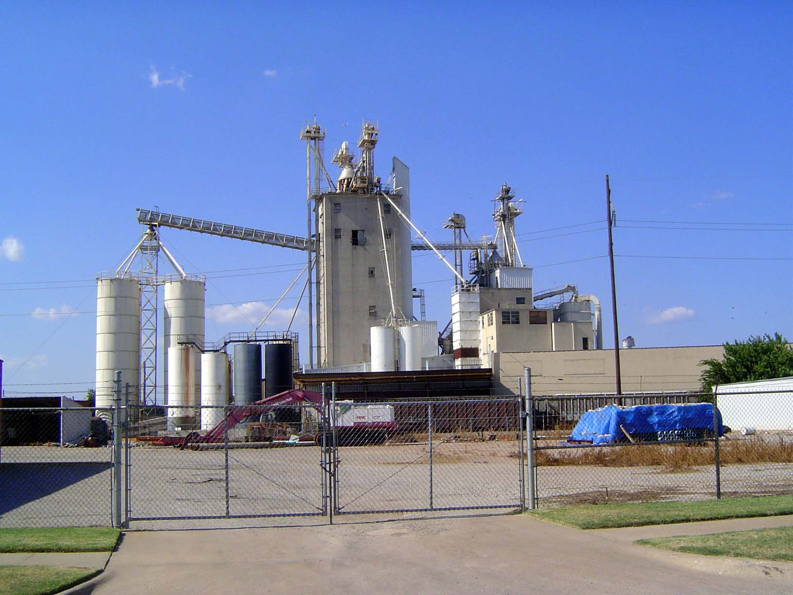 If we jump west, across the site of the former downtown rail yards, we'll find some old Purina elevators. They were built by the Oklahoma Ci