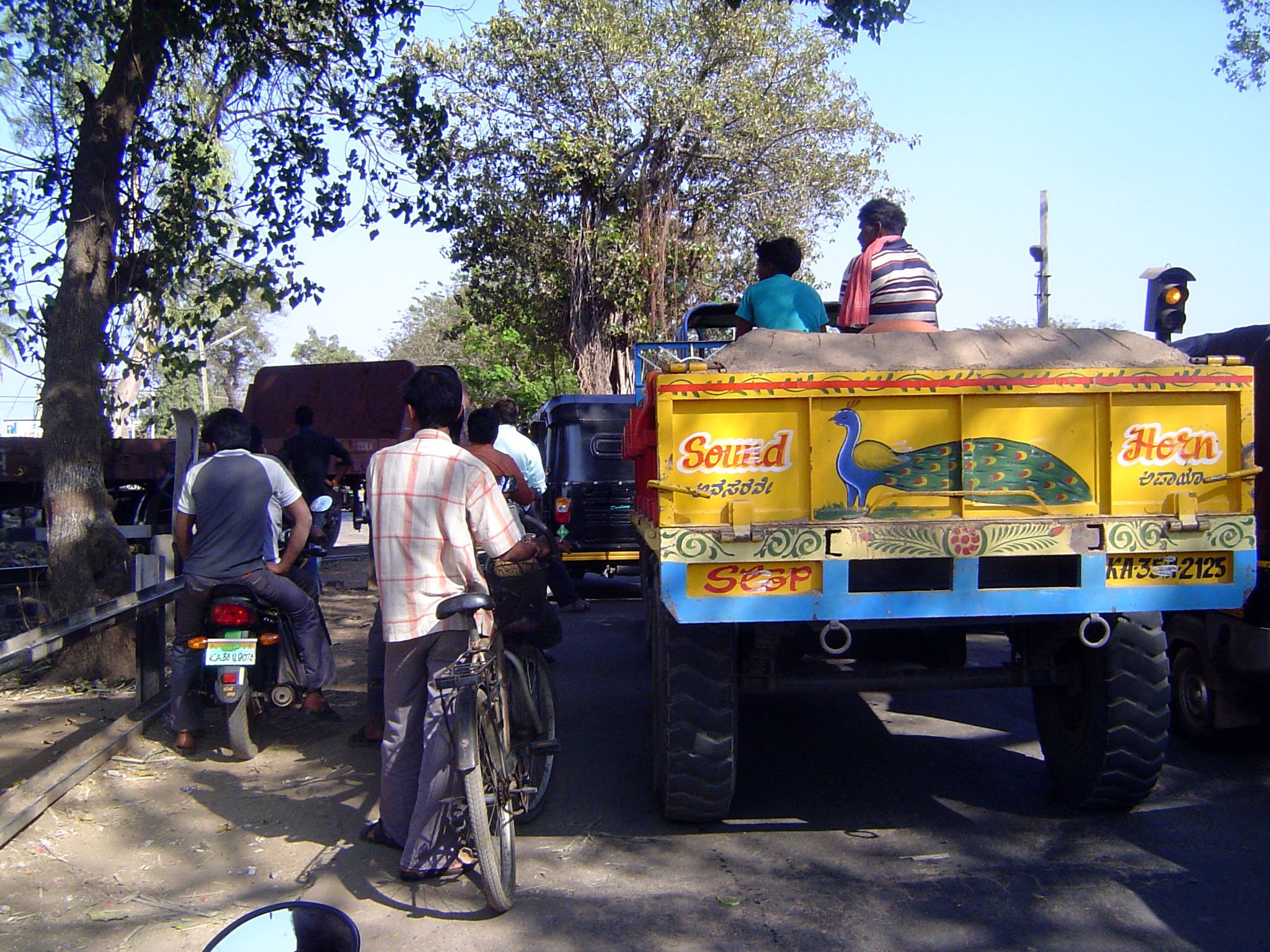 We've gone downstream perhaps 10 miles and are trying to reach Hampi, but we're caught in traffic again. We could get out and find the probl