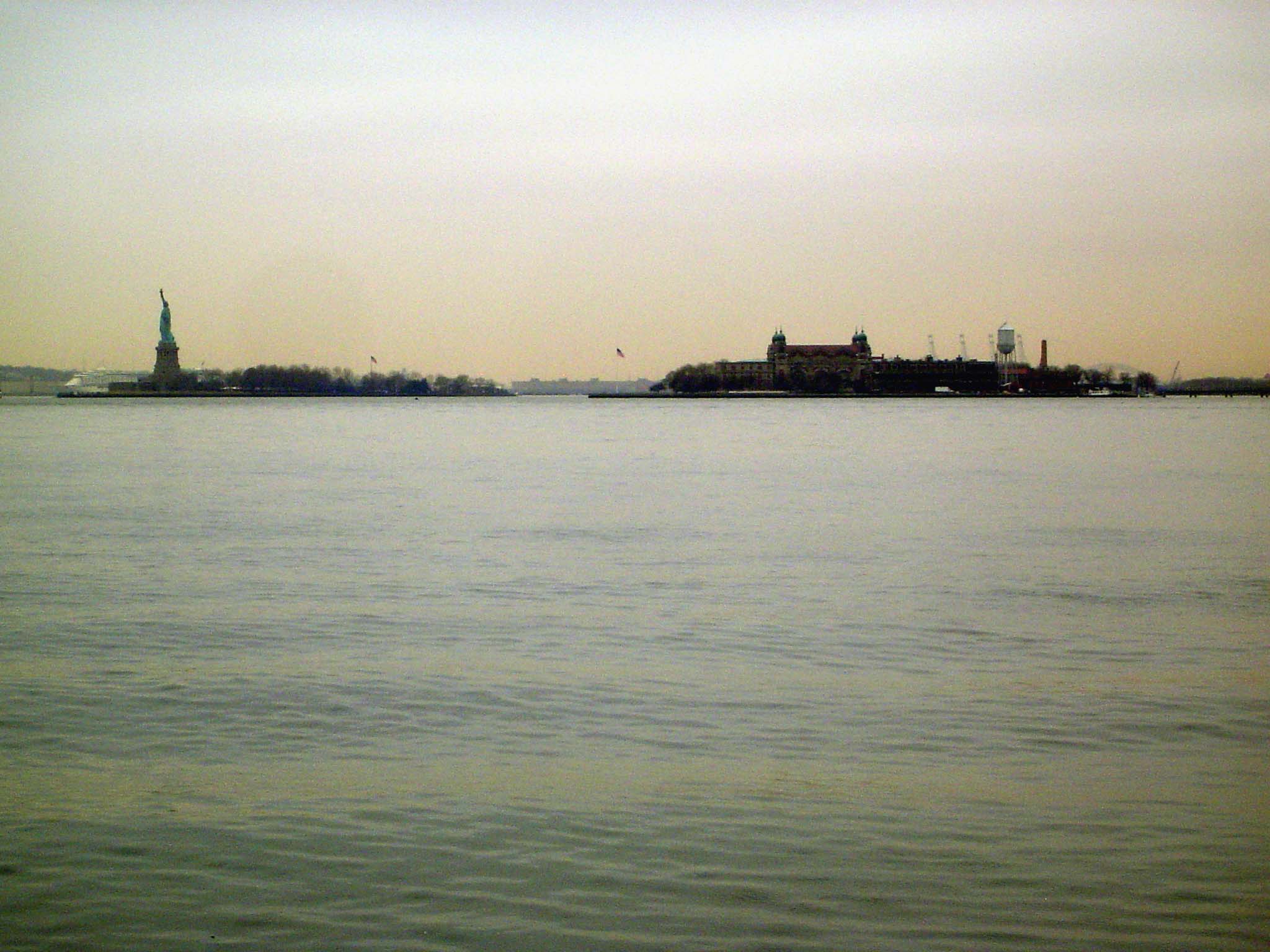 Across the water, the Statue of Liberty and Ellis Island.
