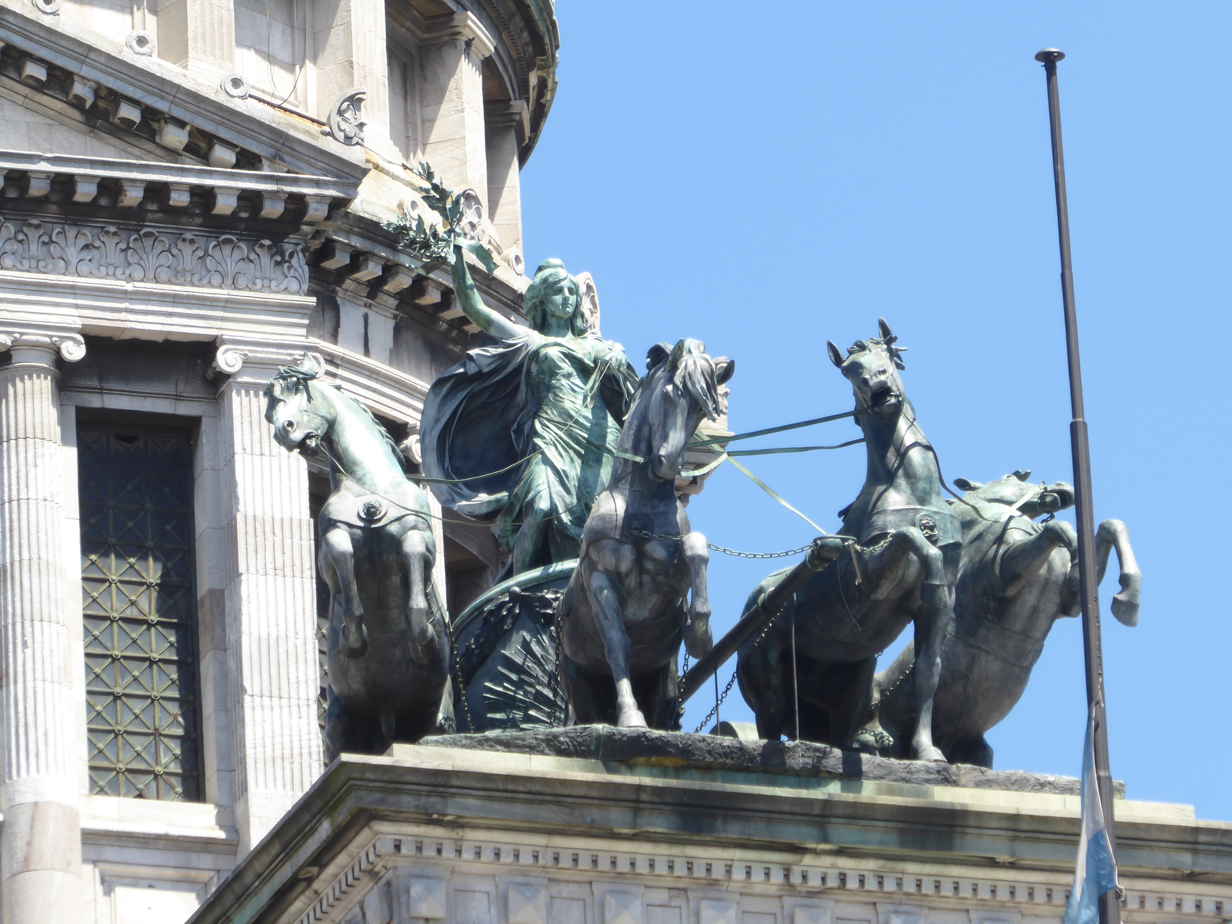 High above the Congreso's entrance of honor is a 20-ton quadriga, its creation the high point of the career of Victor de Pol. We'll see anot