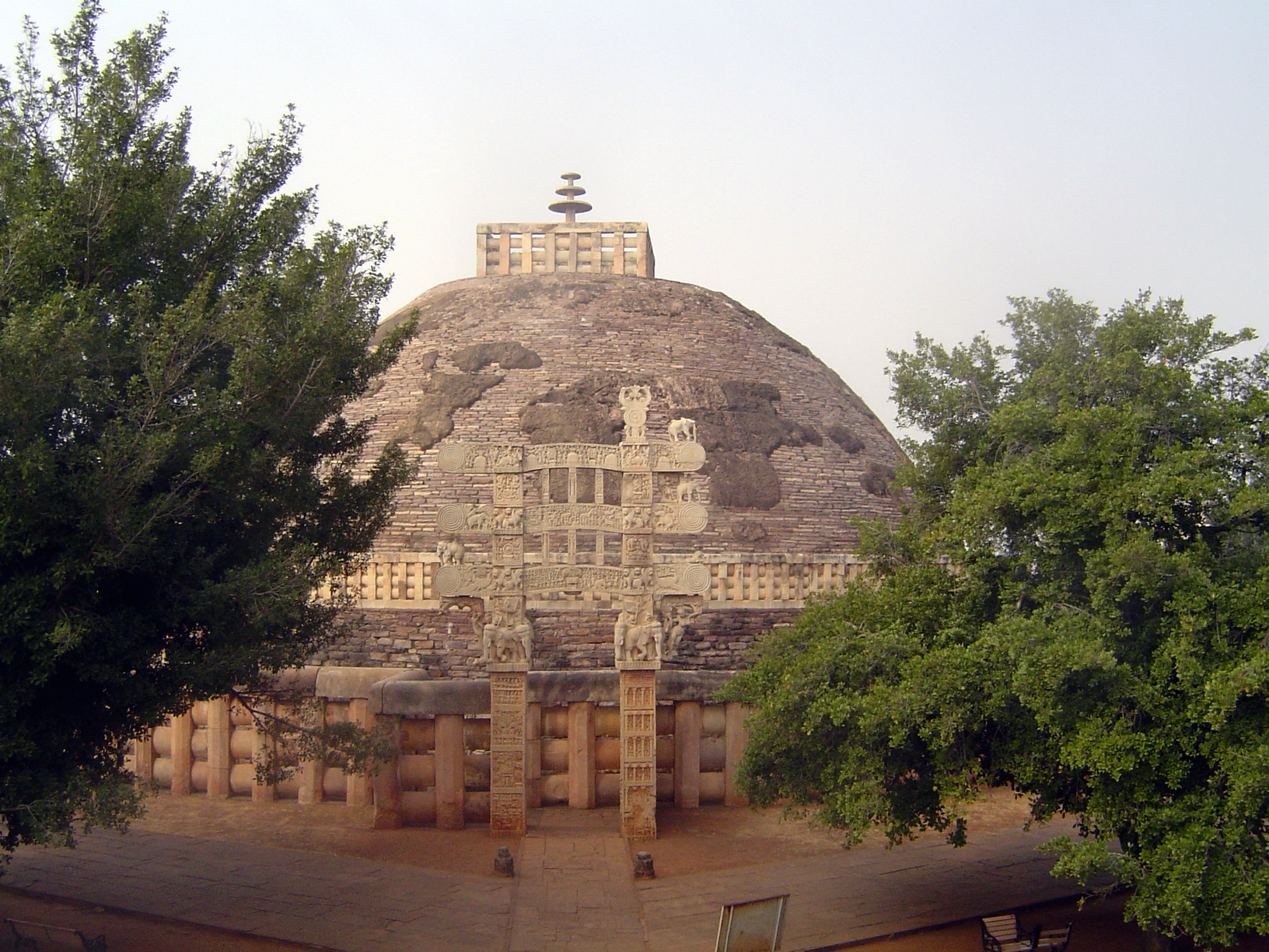 The east side. The stupa was abandoned in the 12th century and discovered by the British in 1818. The south gateway had fallen over, but the