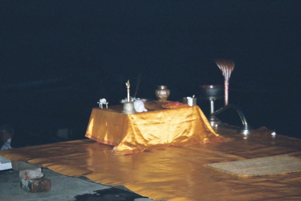 The evening setup at the Dusasvemedh Ghat. The hymn will be sung by a priest panda who sits before the microphone while four assistants act
