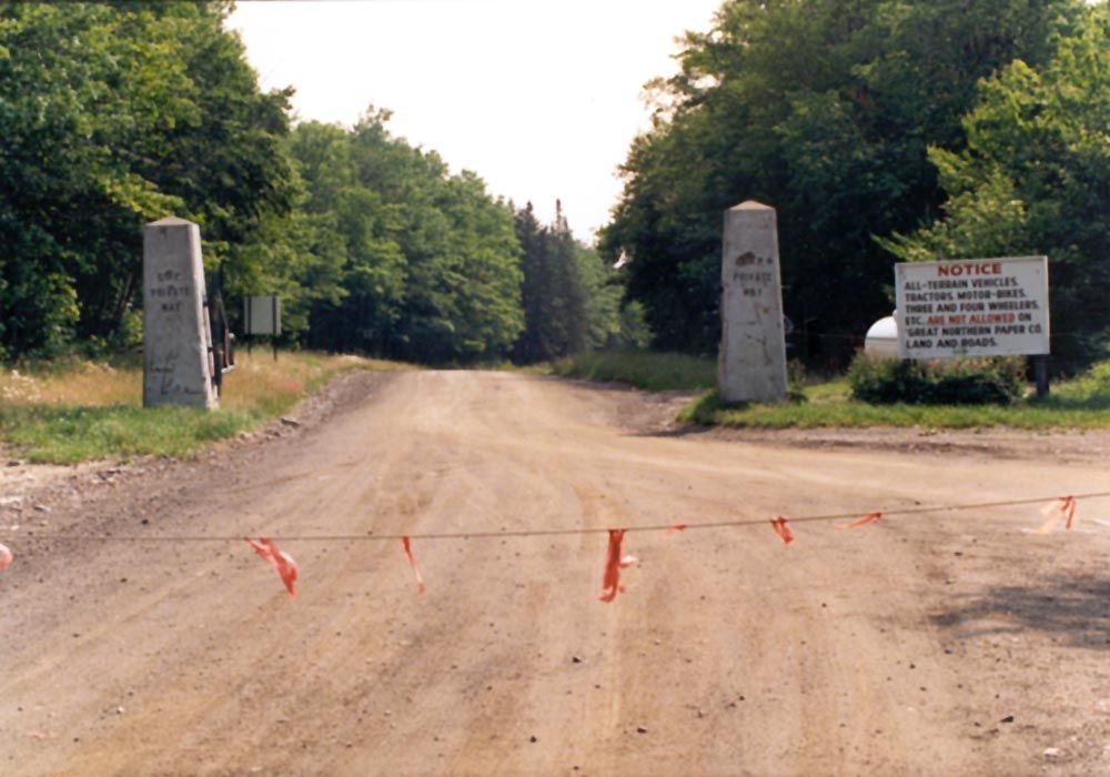 An entrance to one of the private roads. These roads operate year-round, despite the long winter. Trucks lose traction on ice only at winter