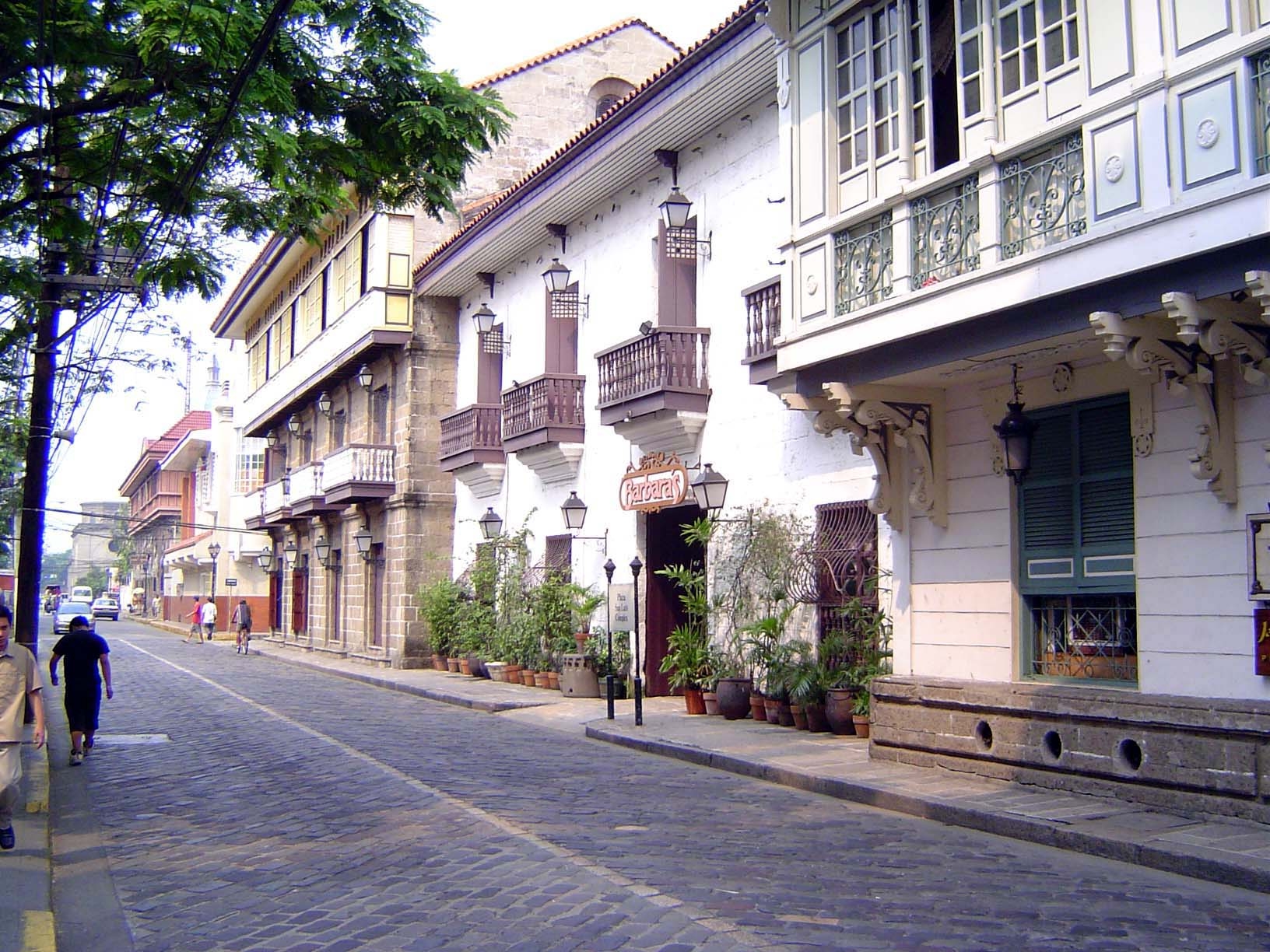 San Agustin is off to the left in this view of the historic main street of Intramuros, the Calle Real, now General Luna. On the right is the
