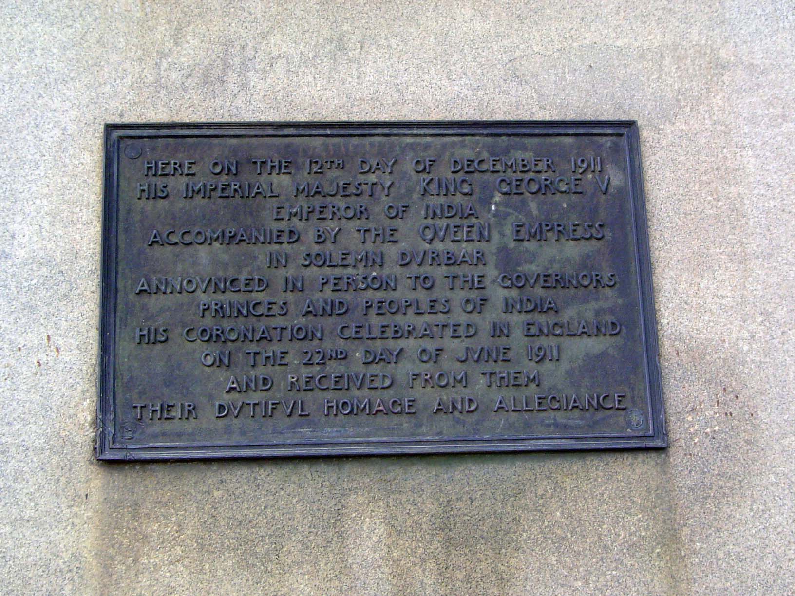 The plaque on the obelisk.