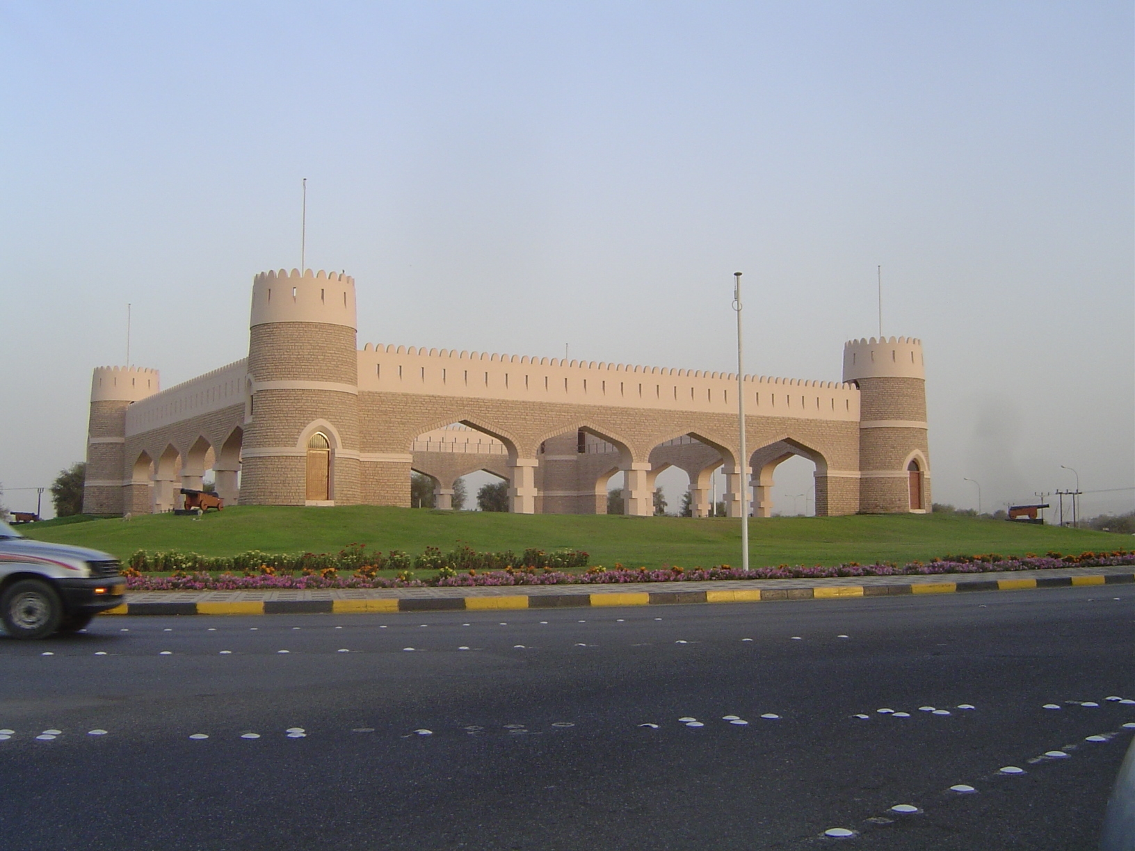 Here, closer to Muscat, is an allusion to the old forts still common in Oman.