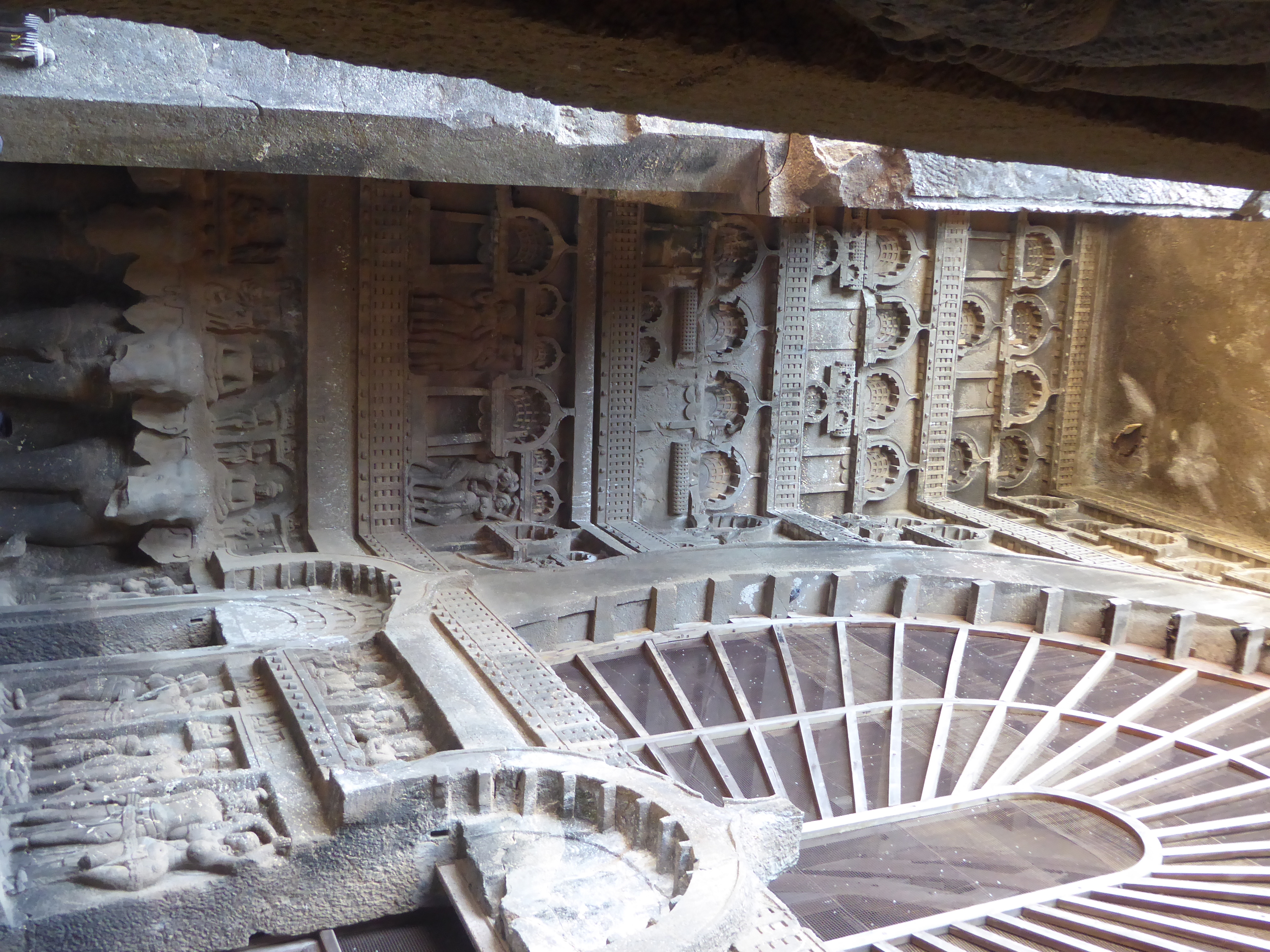 On the sides, too, the Buddhas are later additions, carved under Mahayana influences.