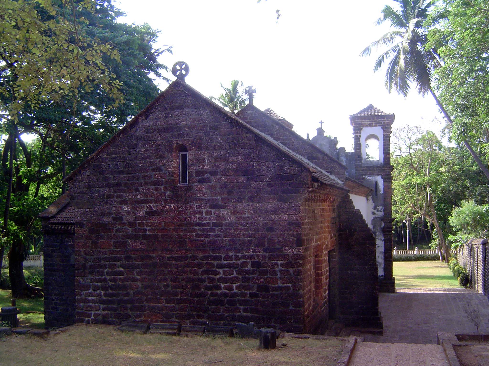 Rear of the church, showing the characteristic laterite blocks.